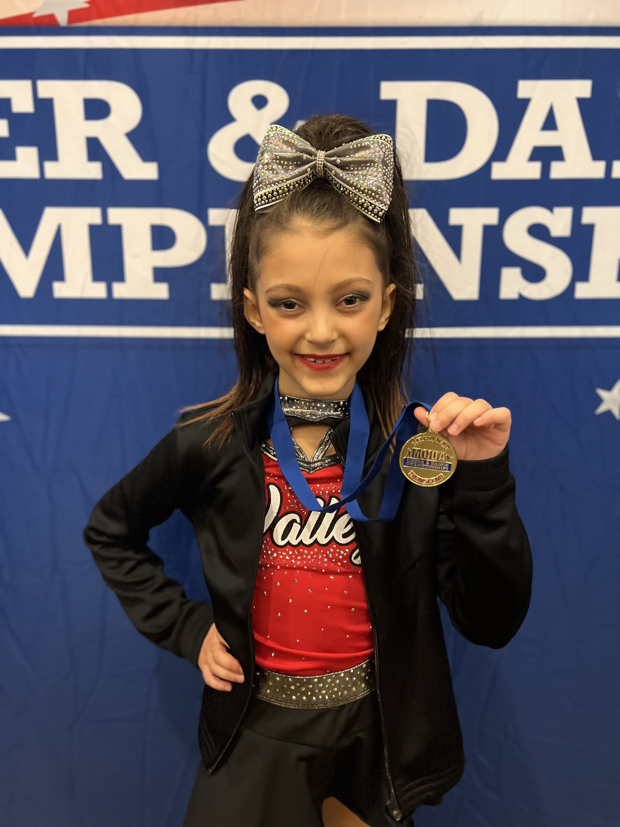 When I am not volunteering, you can find me practicing and performing with my All Star cheer team. It is one of my favorite things to do. Here is just one of the many first place medals we have earned so far this year!