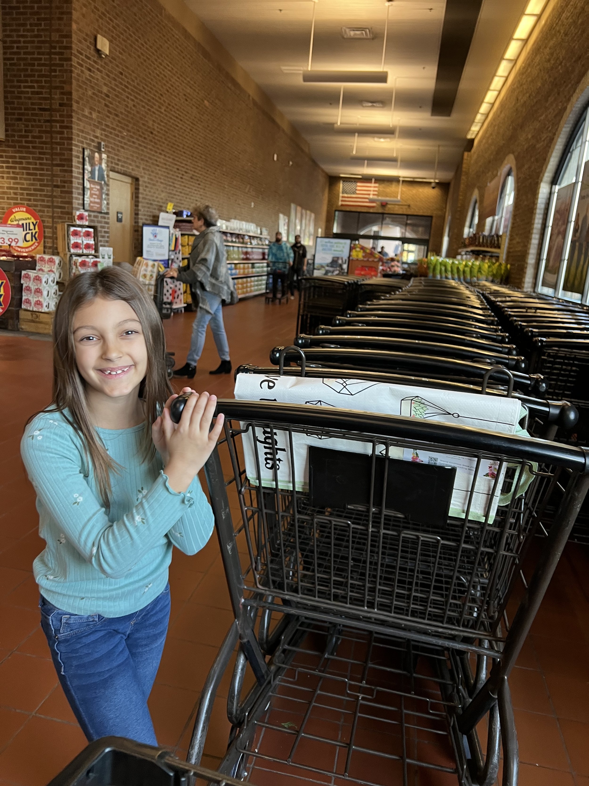 Leaving a reusable shopping bag at a local grocery store as a random act of kindness during World Kindness Week.