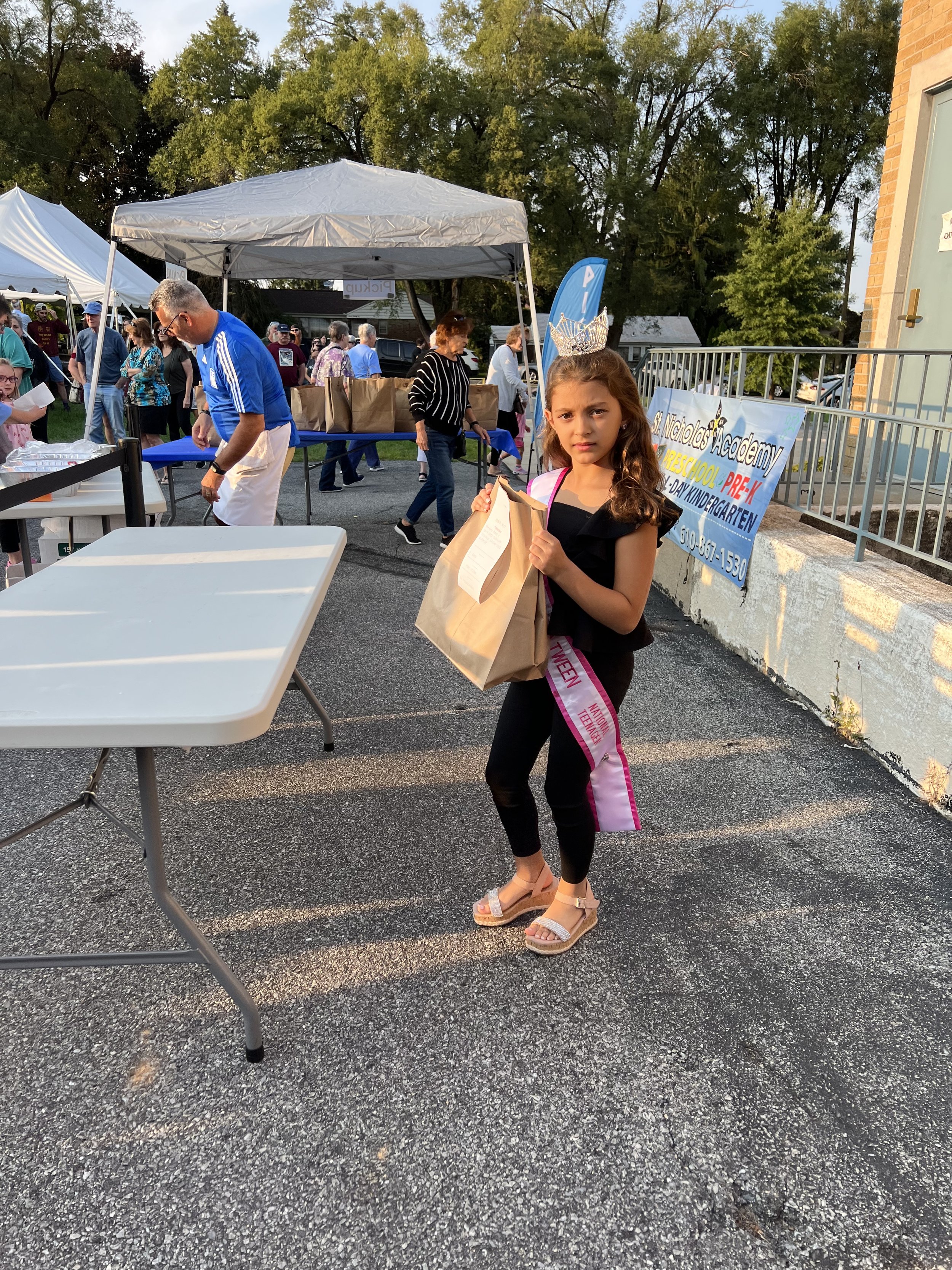 Volunteering at the St. Nicholas Greek Festival. I helped deliver food orders to people.