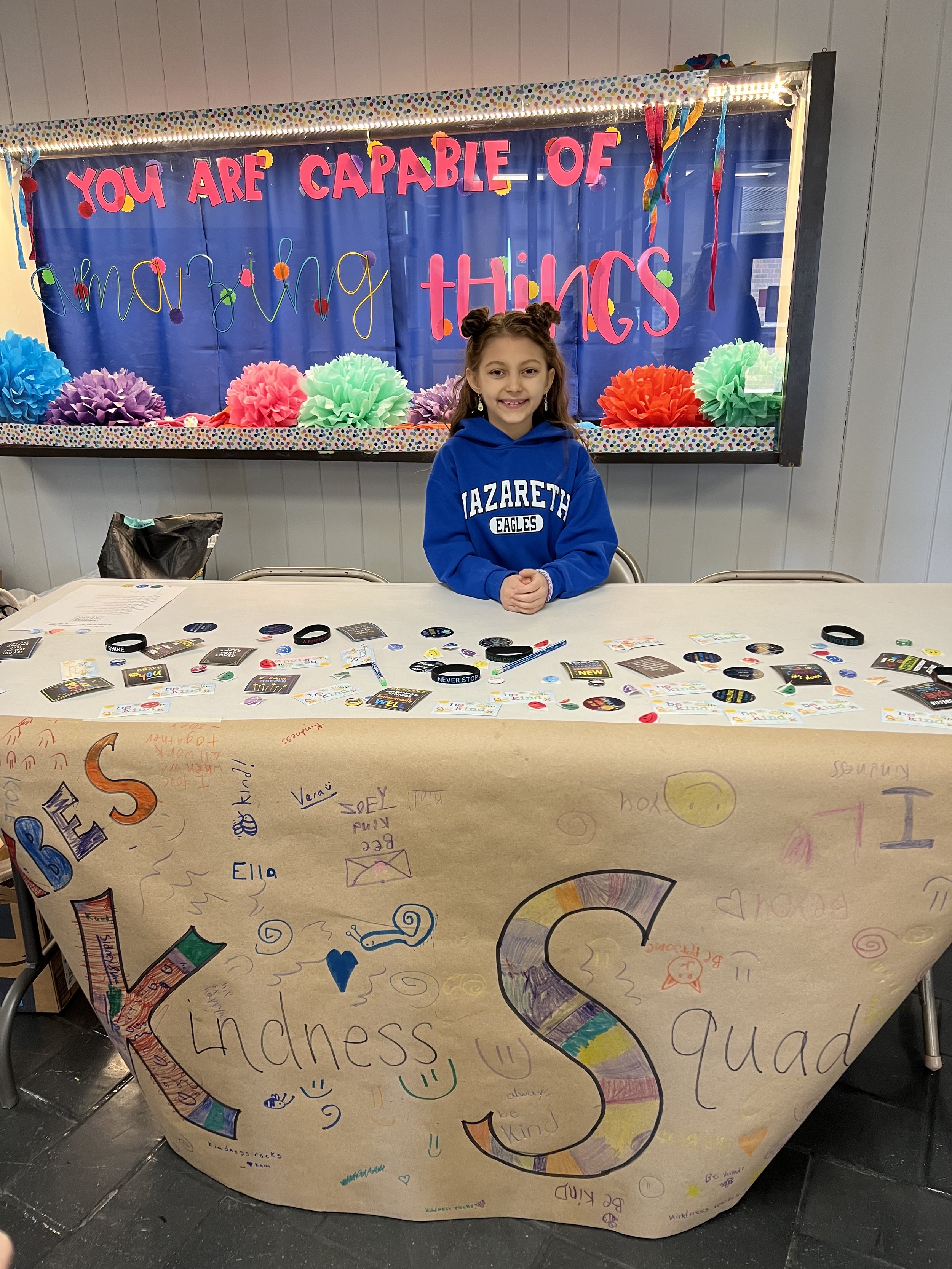 Volunteering with the Kindness Squad at Parent-Teacher conferences at my school. We greeted each parent and helped them find the classrooms.