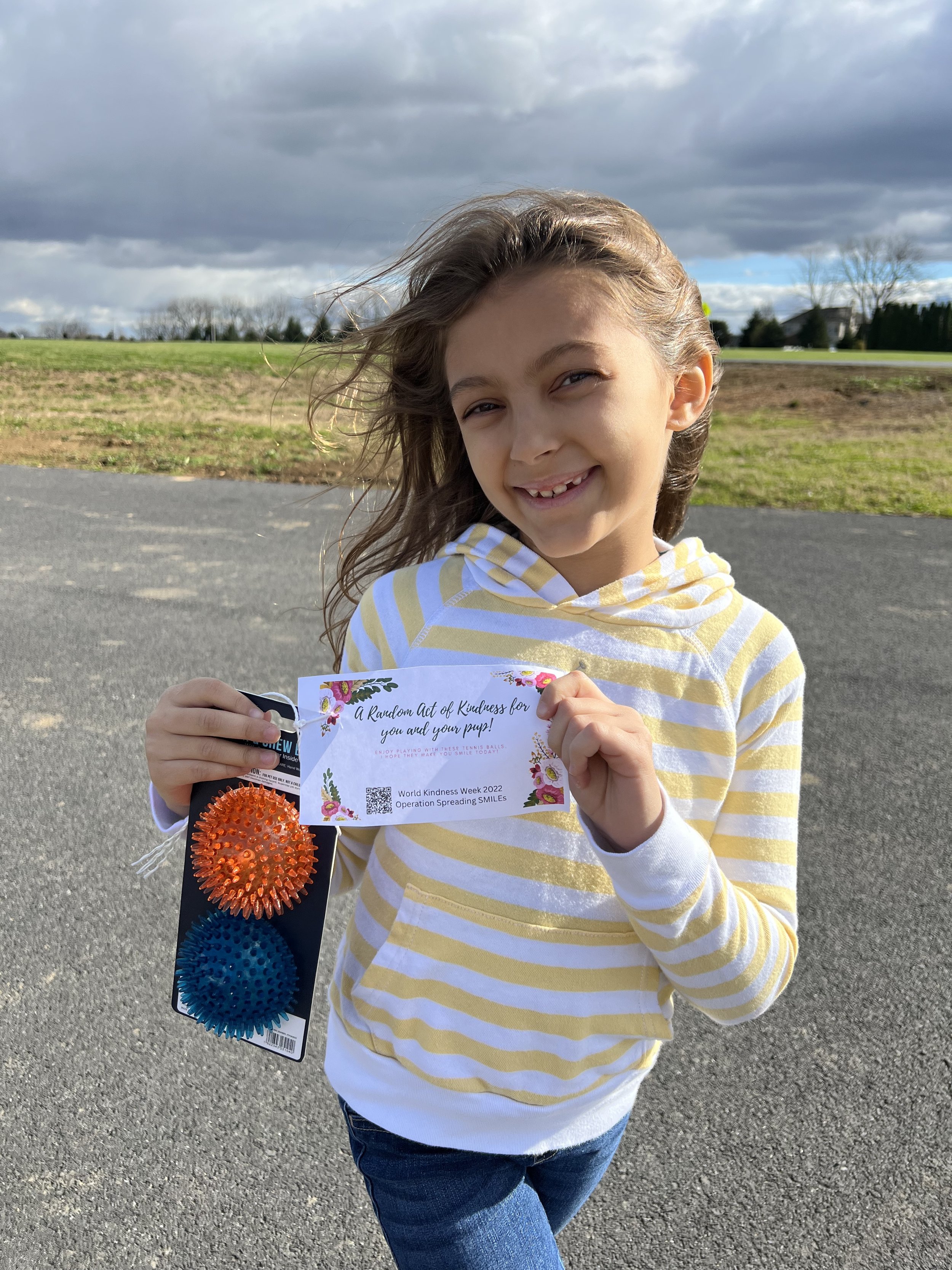 Leaving dog toys at a local dog park during World Kindness Week 2022