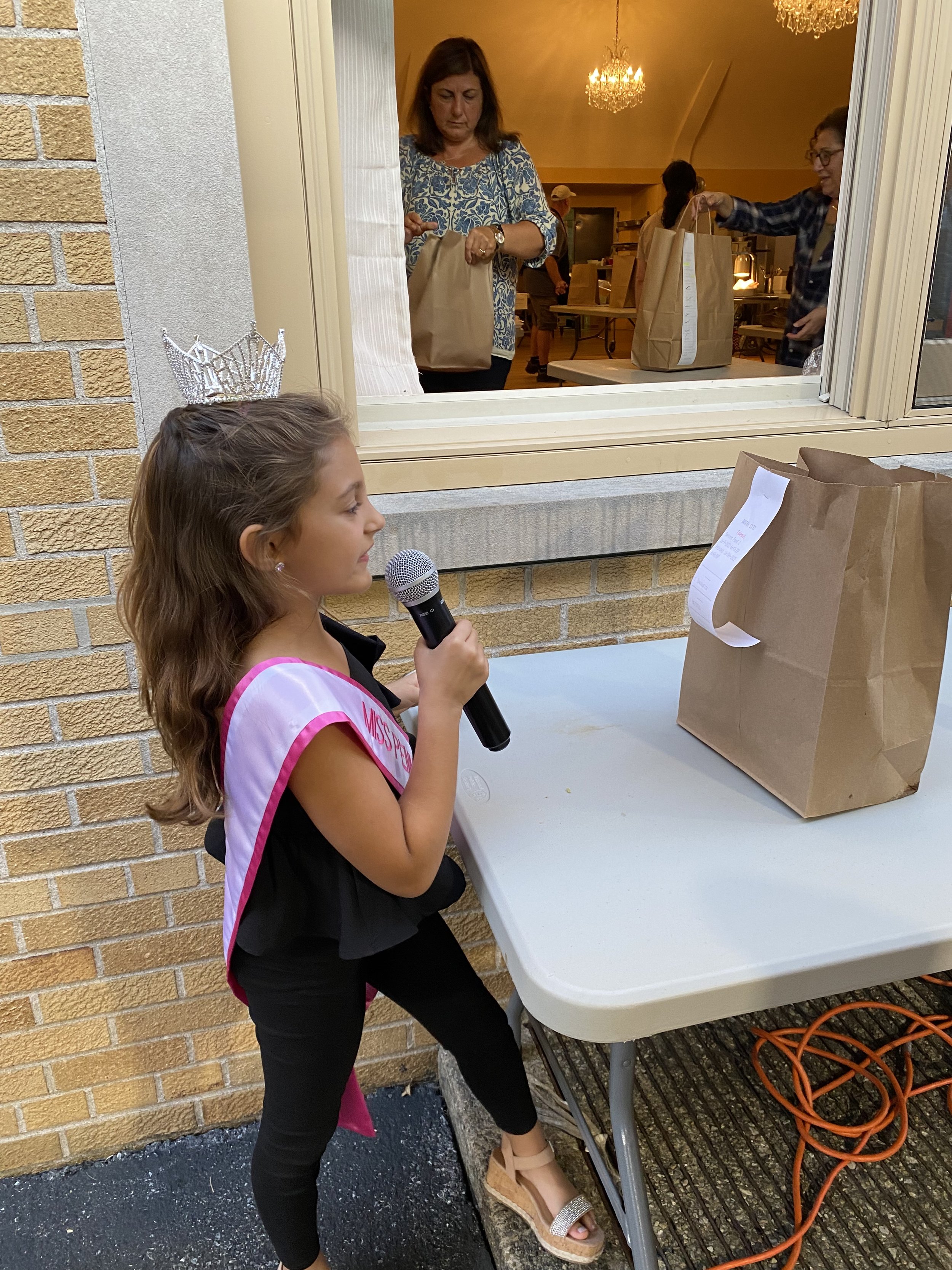 Volunteering at St. Nicholas Greek Festival. I was calling out order numbers.
