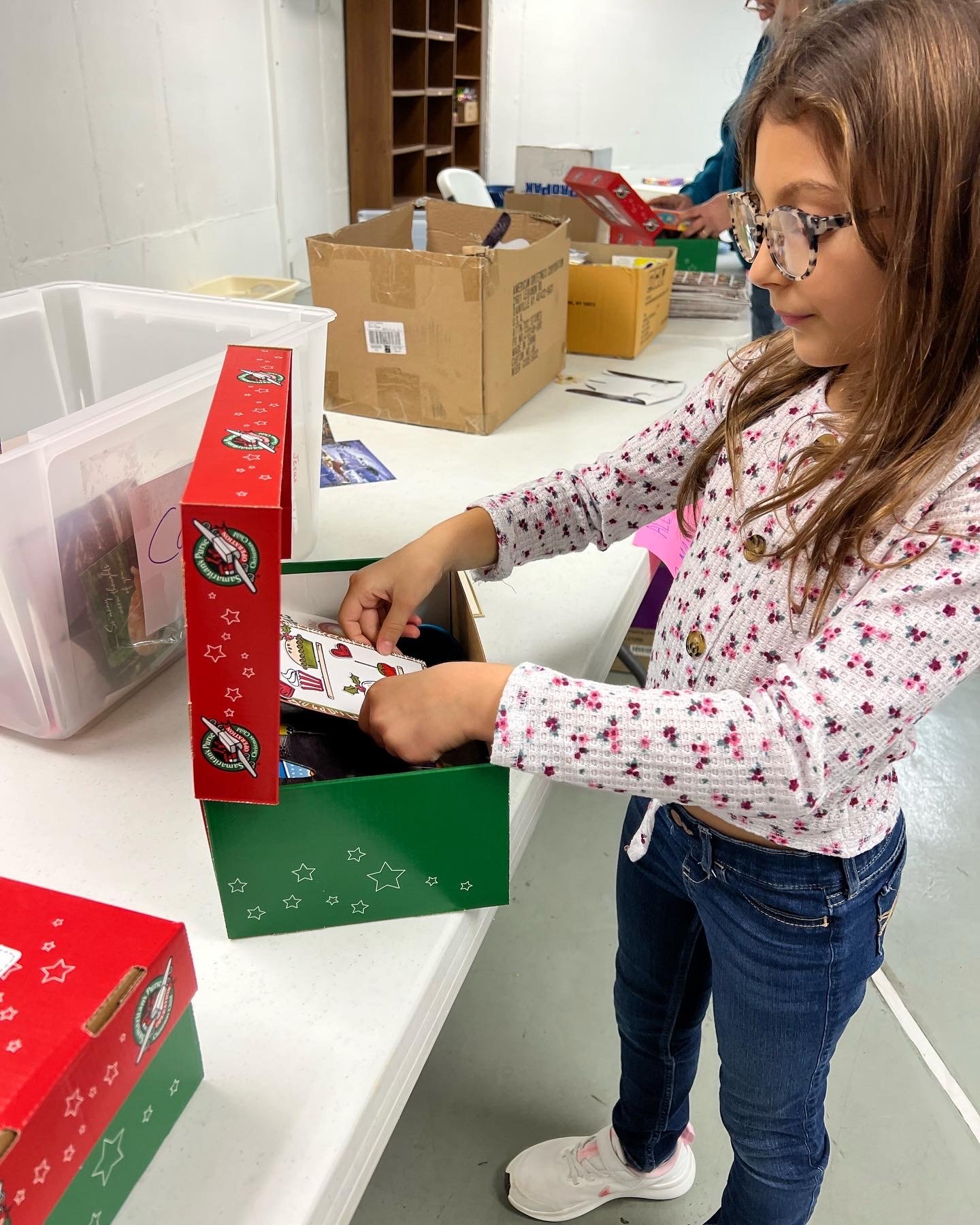 Packing boxes for Operation Christmas Child.