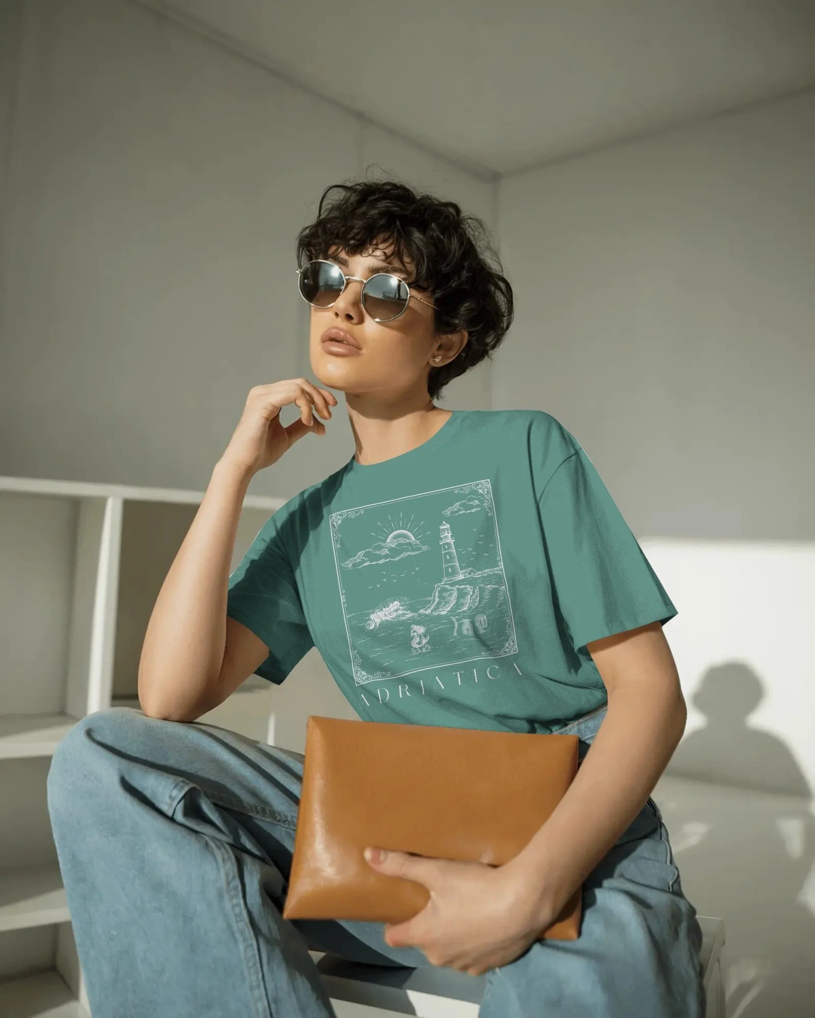 contemporary-studio-t-shirt-mockup-fashion-model-with-curly-hair-and-sleek-round-sunglasses-01991 copy.jpg