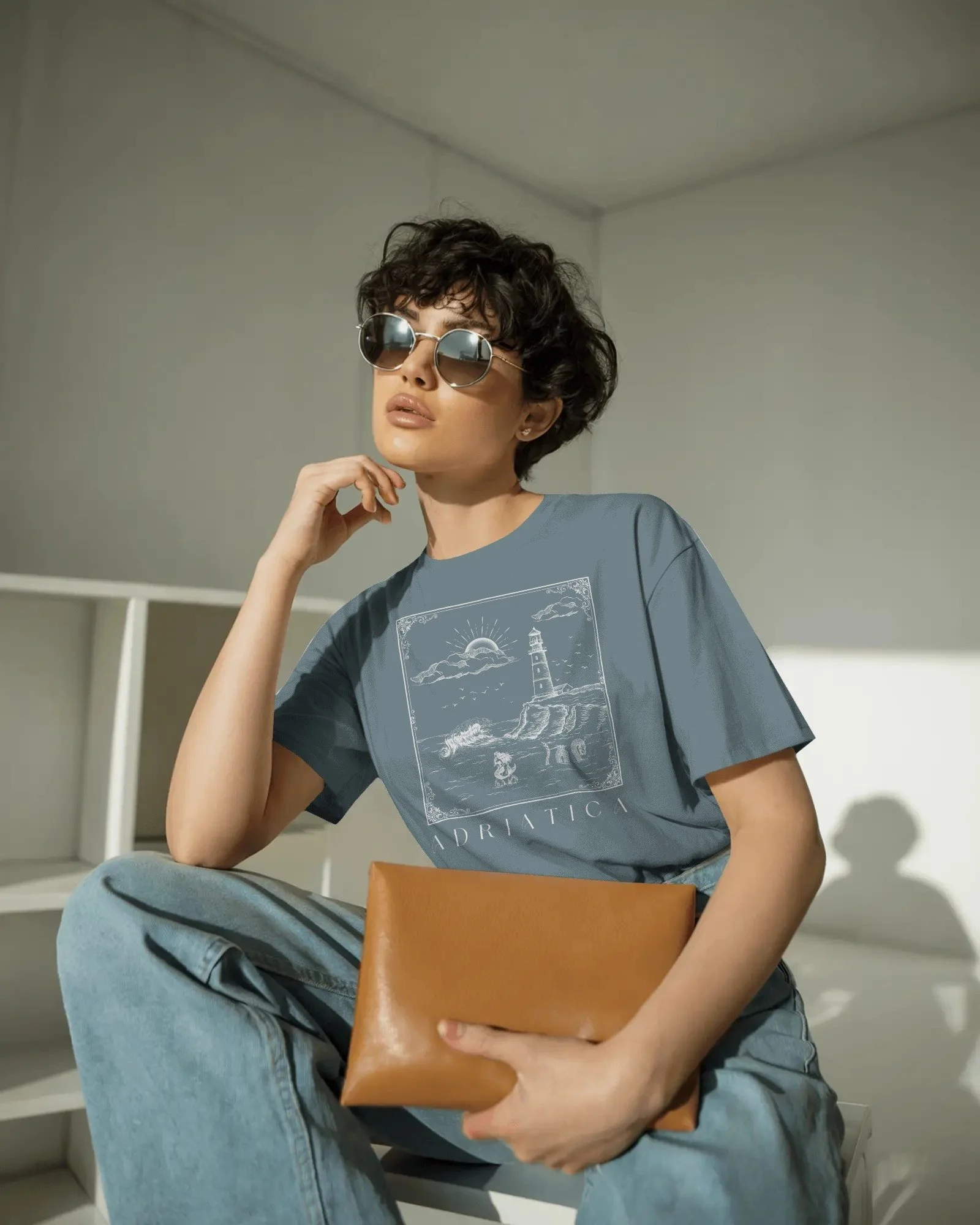 contemporary-studio-t-shirt-mockup-fashion-model-with-curly-hair-and-sleek-round-sunglasses-01991 copy 2.jpg