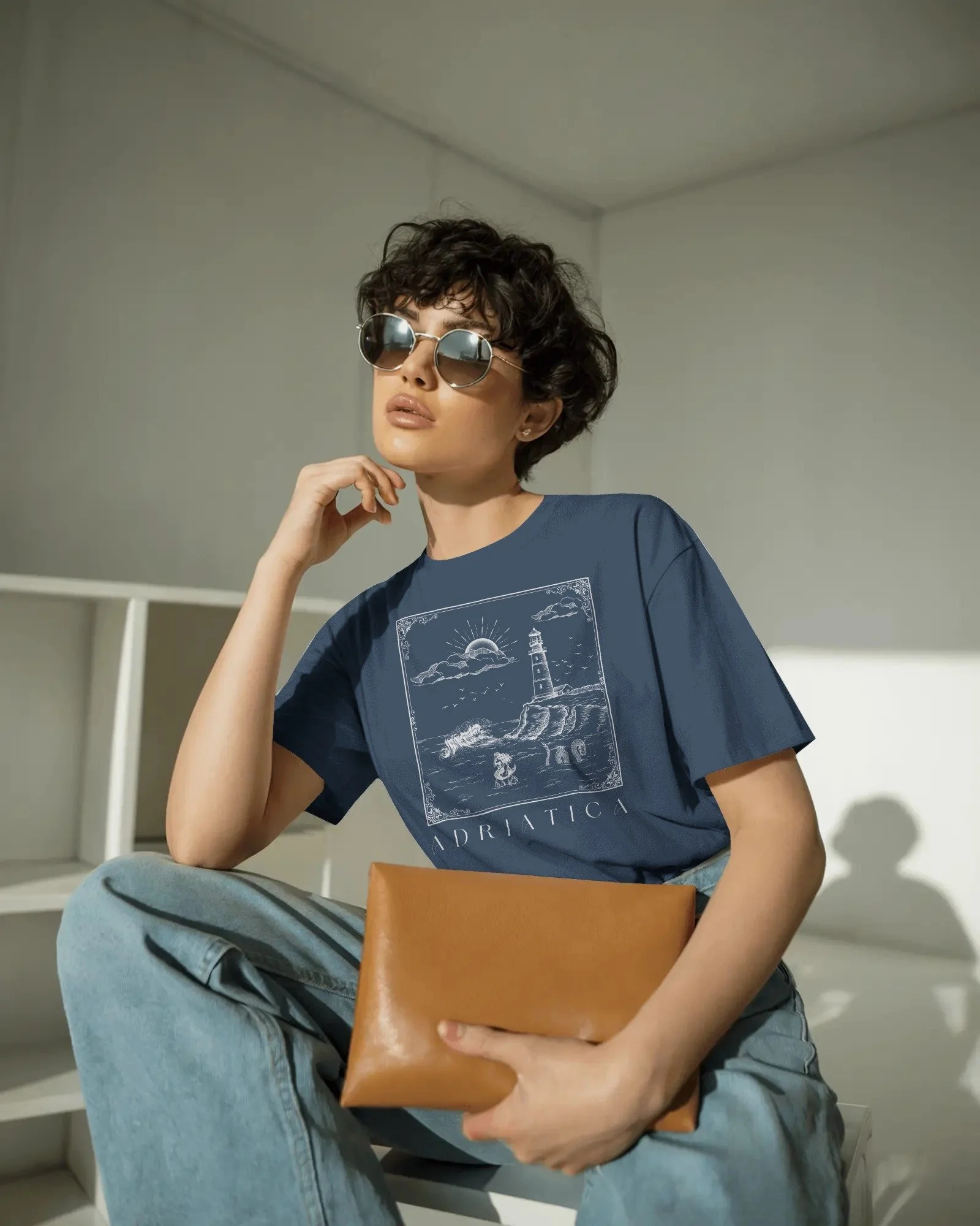 contemporary-studio-t-shirt-mockup-fashion-model-with-curly-hair-and-sleek-round-sunglasses-01991 copy 5.jpg