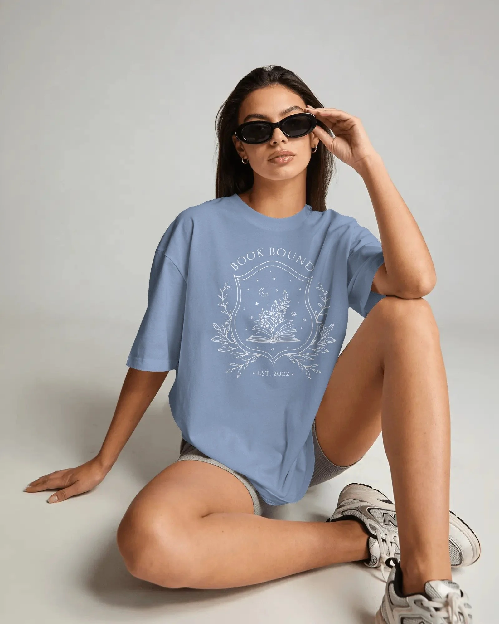 amazon-tshirt-mockup-female-model-sitting-on-studio-floor-wearing-sunglasses-with-casual-fashion-04063.jpg