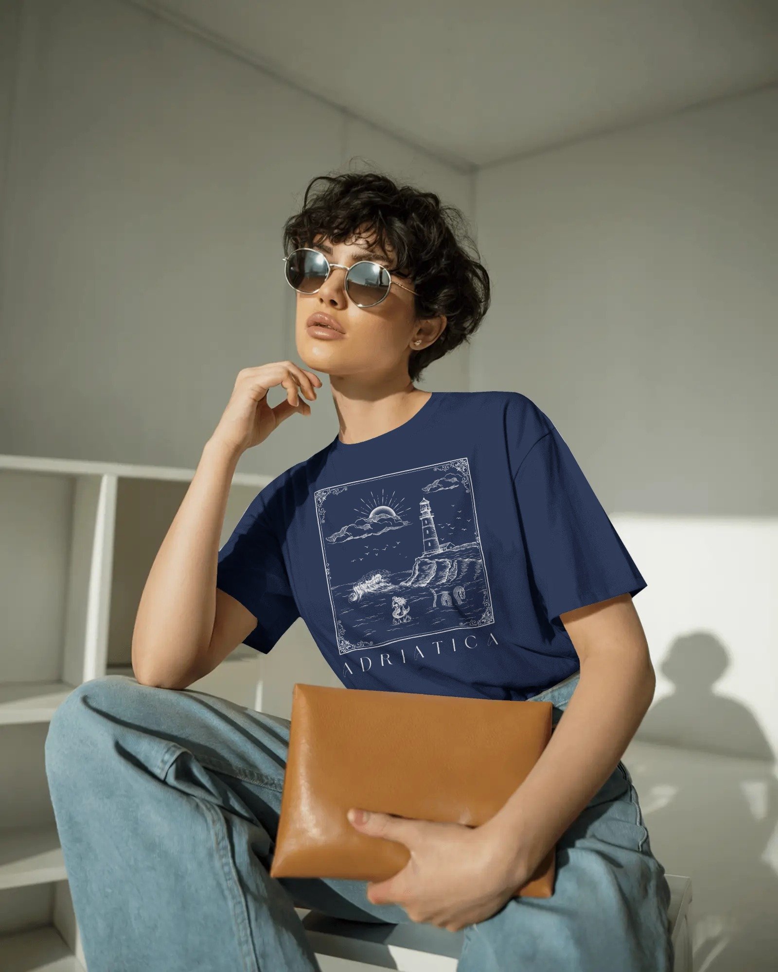 contemporary-studio-t-shirt-mockup-fashion-model-with-curly-hair-and-sleek-round-sunglasses-01991 copy 6.jpg