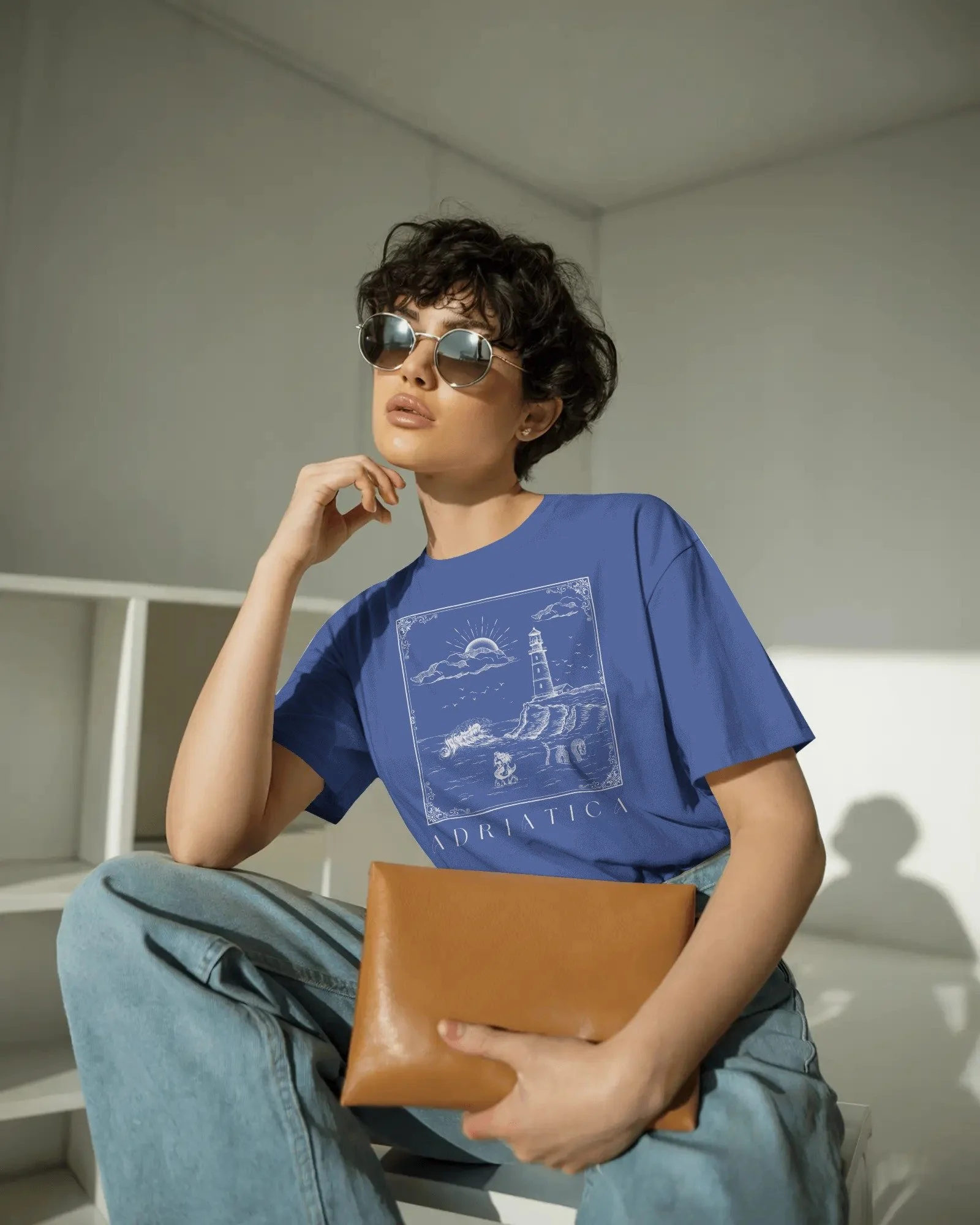 contemporary-studio-t-shirt-mockup-fashion-model-with-curly-hair-and-sleek-round-sunglasses-01991 copy 4.jpg