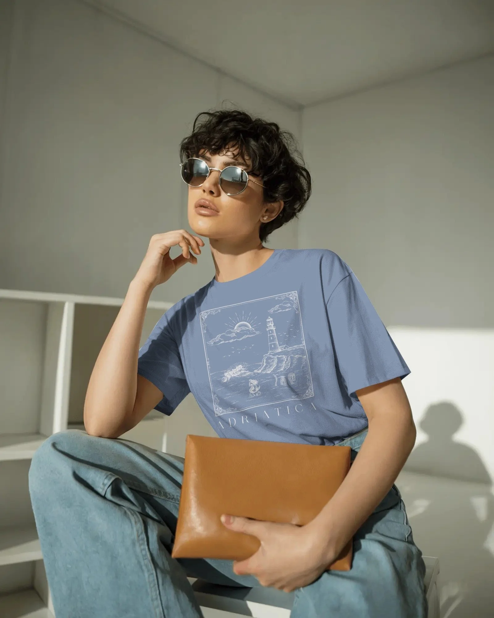 contemporary-studio-t-shirt-mockup-fashion-model-with-curly-hair-and-sleek-round-sunglasses-01991.jpg
