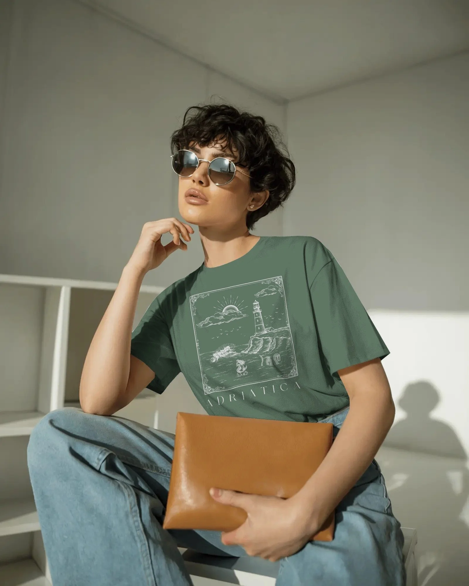 contemporary-studio-t-shirt-mockup-fashion-model-with-curly-hair-and-sleek-round-sunglasses-01991 copy 3.jpg