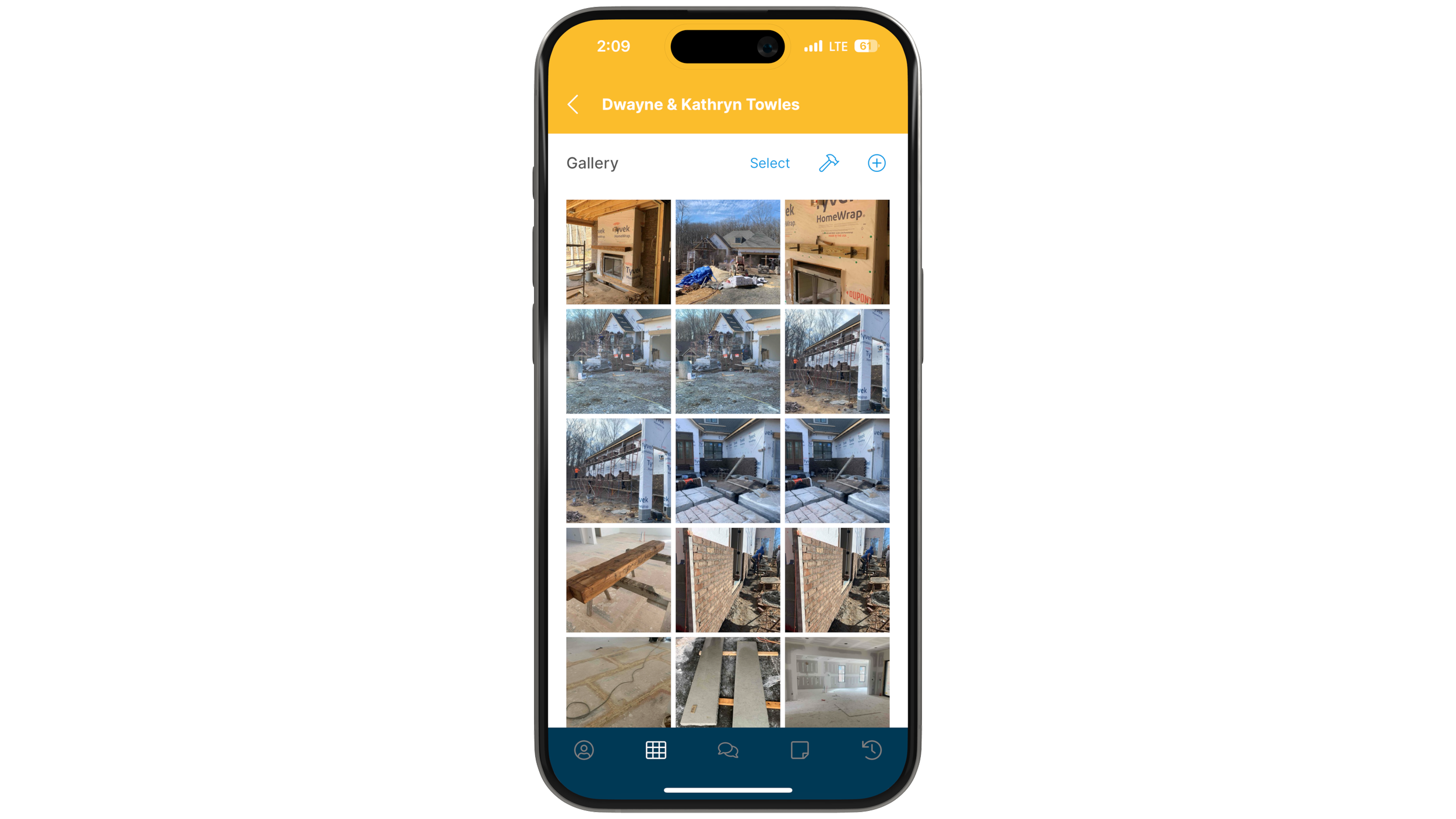 Smartphone displaying a gallery of construction site photos, including building materials and partially constructed structures.