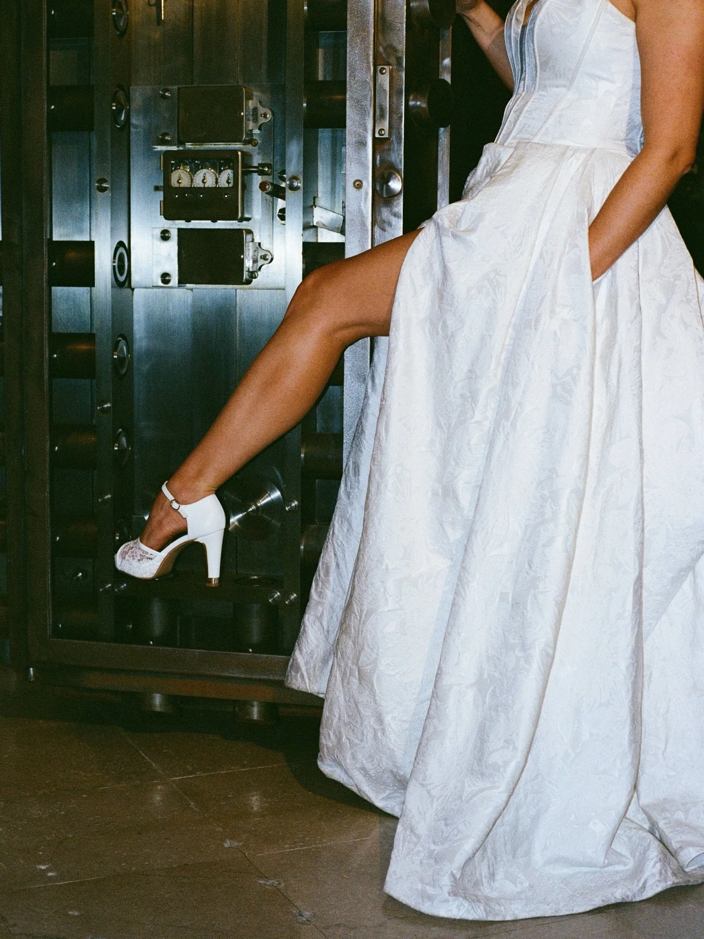 Treasury 1929 wedding photos have a way of feeling different in the speakeasy, especially on film. 

Lower light calls for flash and extra light, giving it this delicious editorial crunchy taste. 
Texture.
The vault door open. 

Can you guess which s