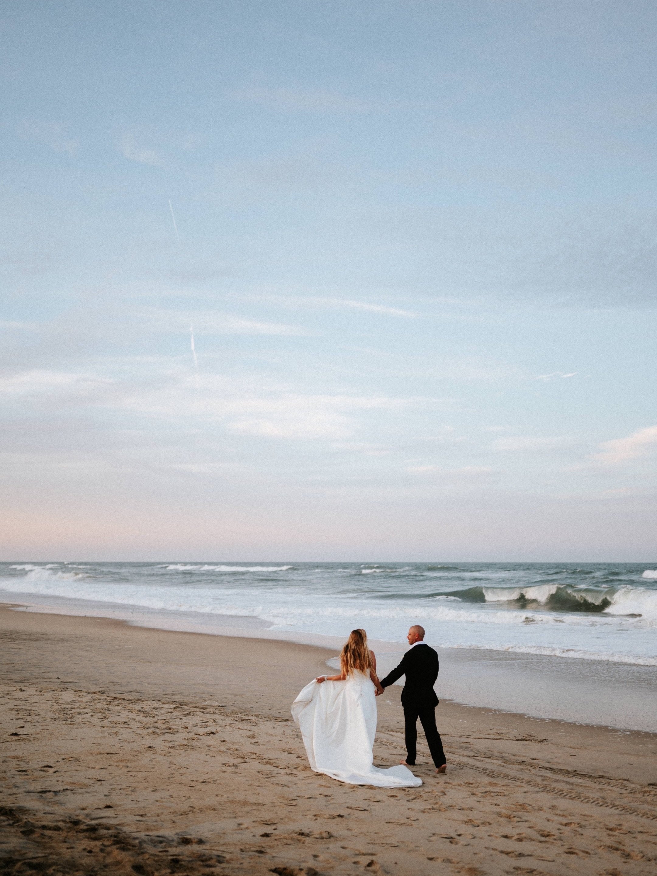Looking at the sunset on the first day of the rest of your life as a married couple is always such a special moment.  I must admit bare feet in the sand with the crushing waves melody made it extra special for Alex and Matt. 
Then I look up and 2 bir