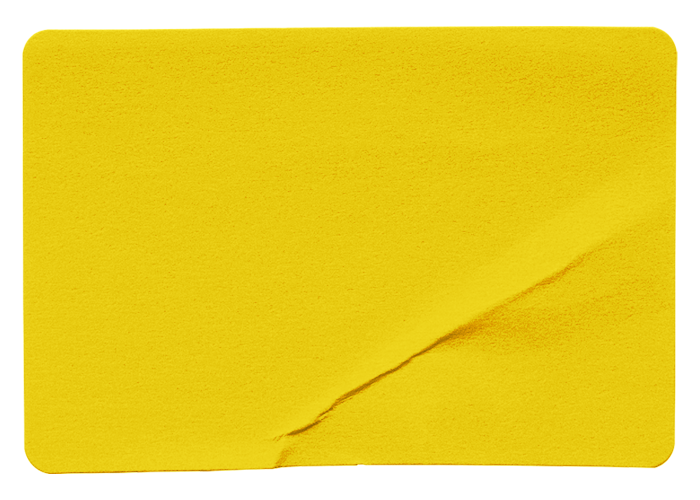 A yellow sticky note with a diagonal tear in the lower right corner.
