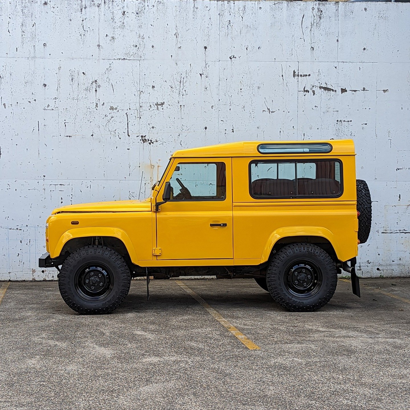 Tweety bird. 

Plucked from a Tasmanian farmer some time ago, this TD5 90 Xtreme was treated to a full exterior respray with some accoutrements, Fox shocks, interior rejuvenation and 4 rear seats to create one of the most identifiable and stunning De