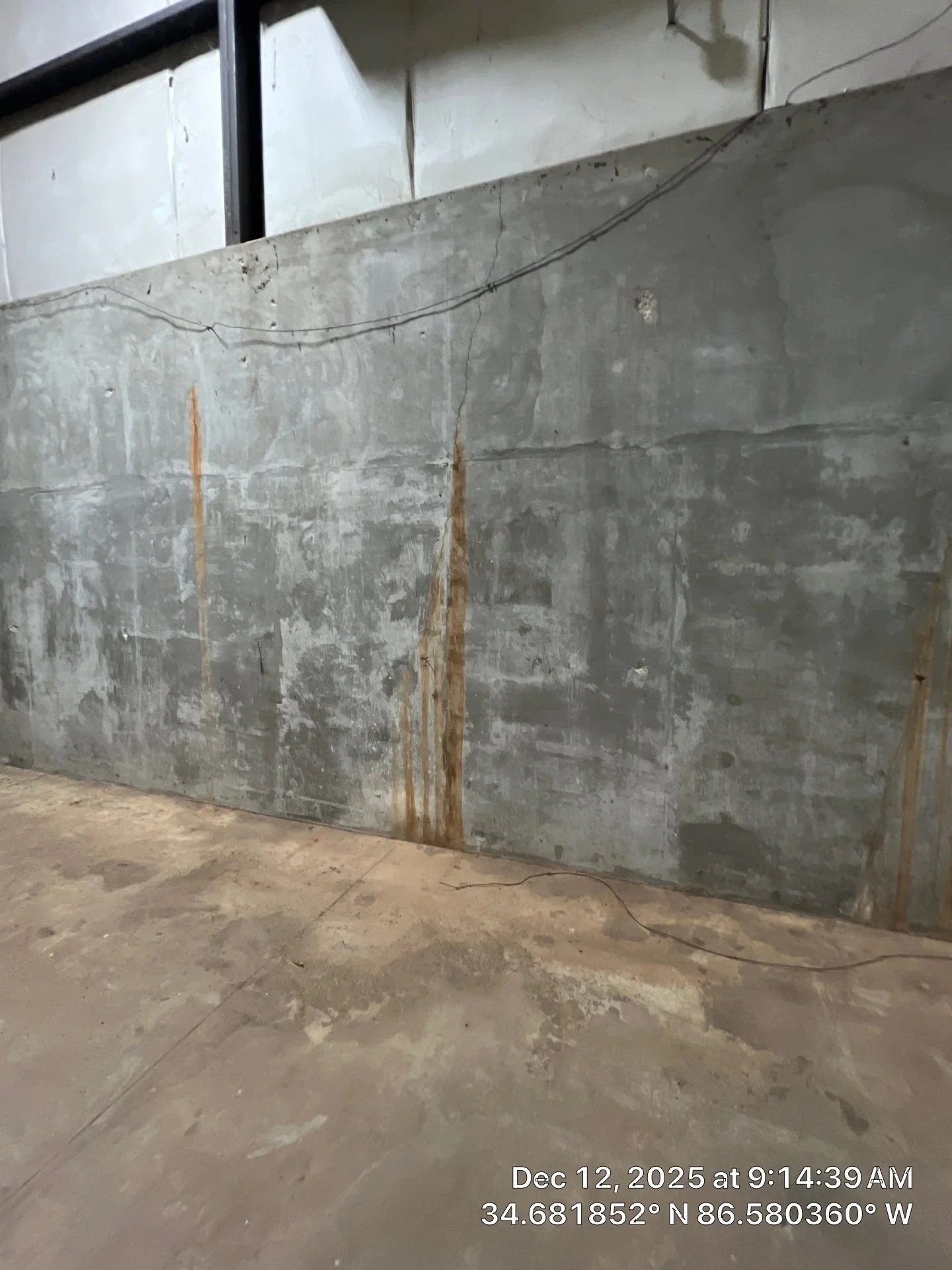 6 Multiple rust runs on a below-grade concrete wall.jpg