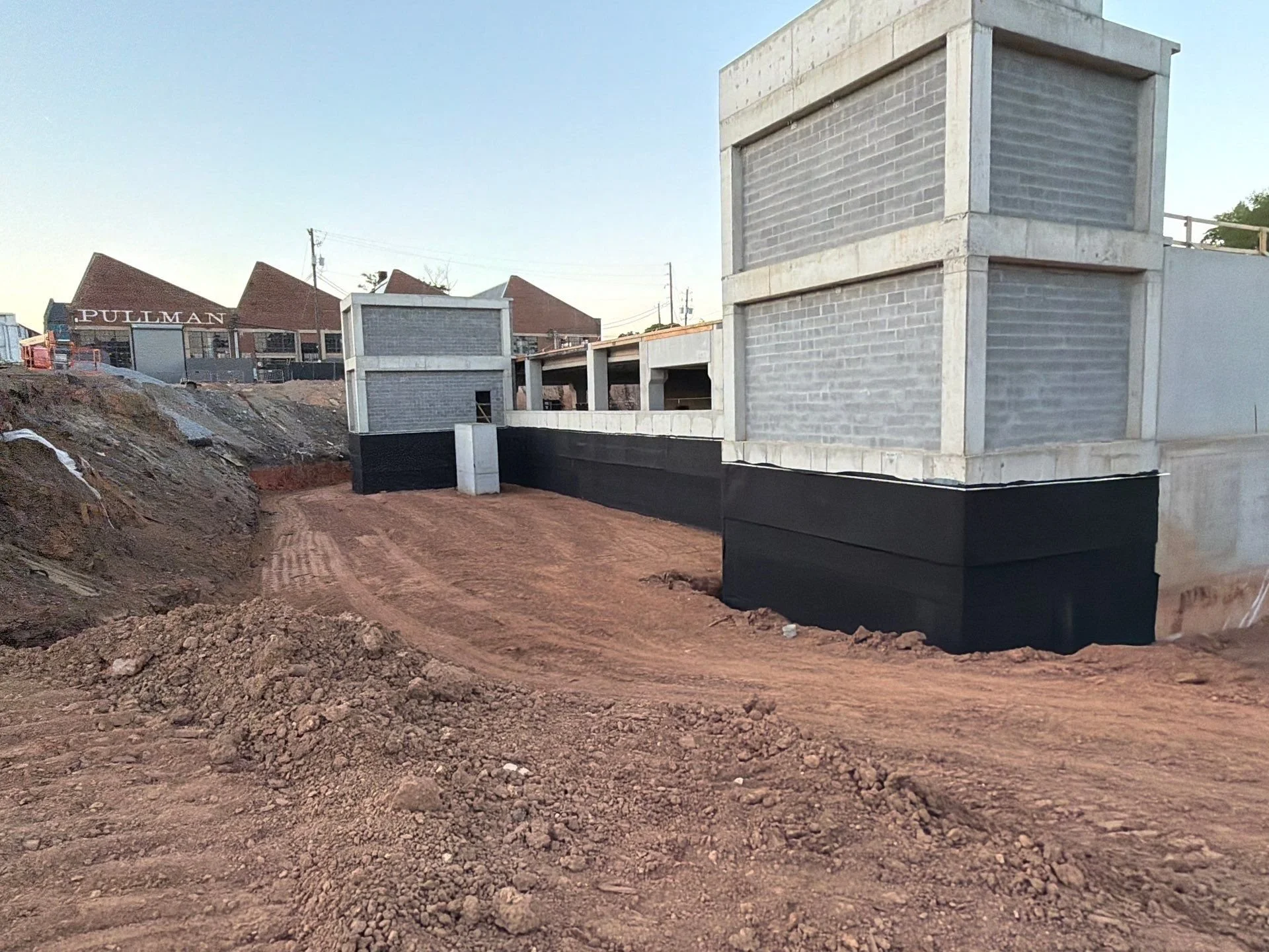 Henry Blueskin WP200 below grade system with drainage mat partially backfilled