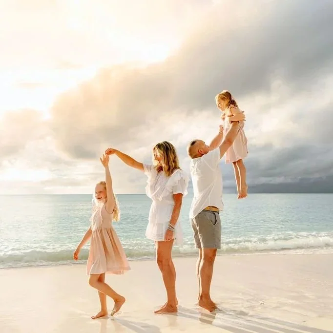 Family photo session on Seven Mile Beach near Palm Heights, Tillies