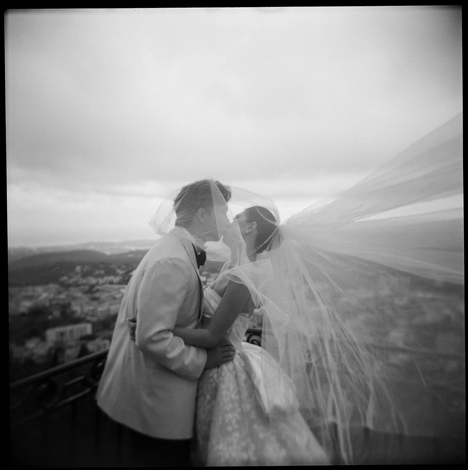 bw analog wedding kiss veil in wind