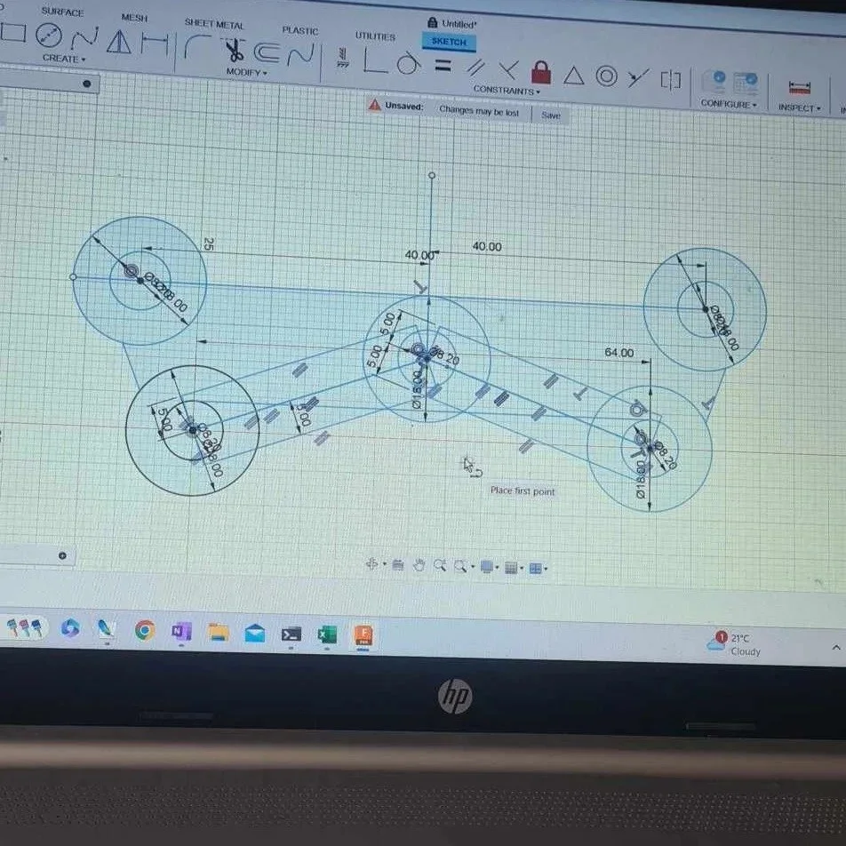 CAD drawing of a mechanical linkage with four circular joints connected by straight links, featuring various dimensions and angles.