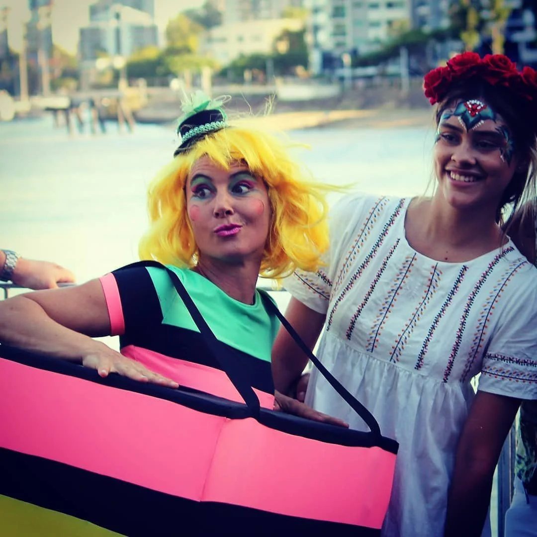 Sweet themed entertainers in liquorice costumes delighting guests at Brisbane community event.