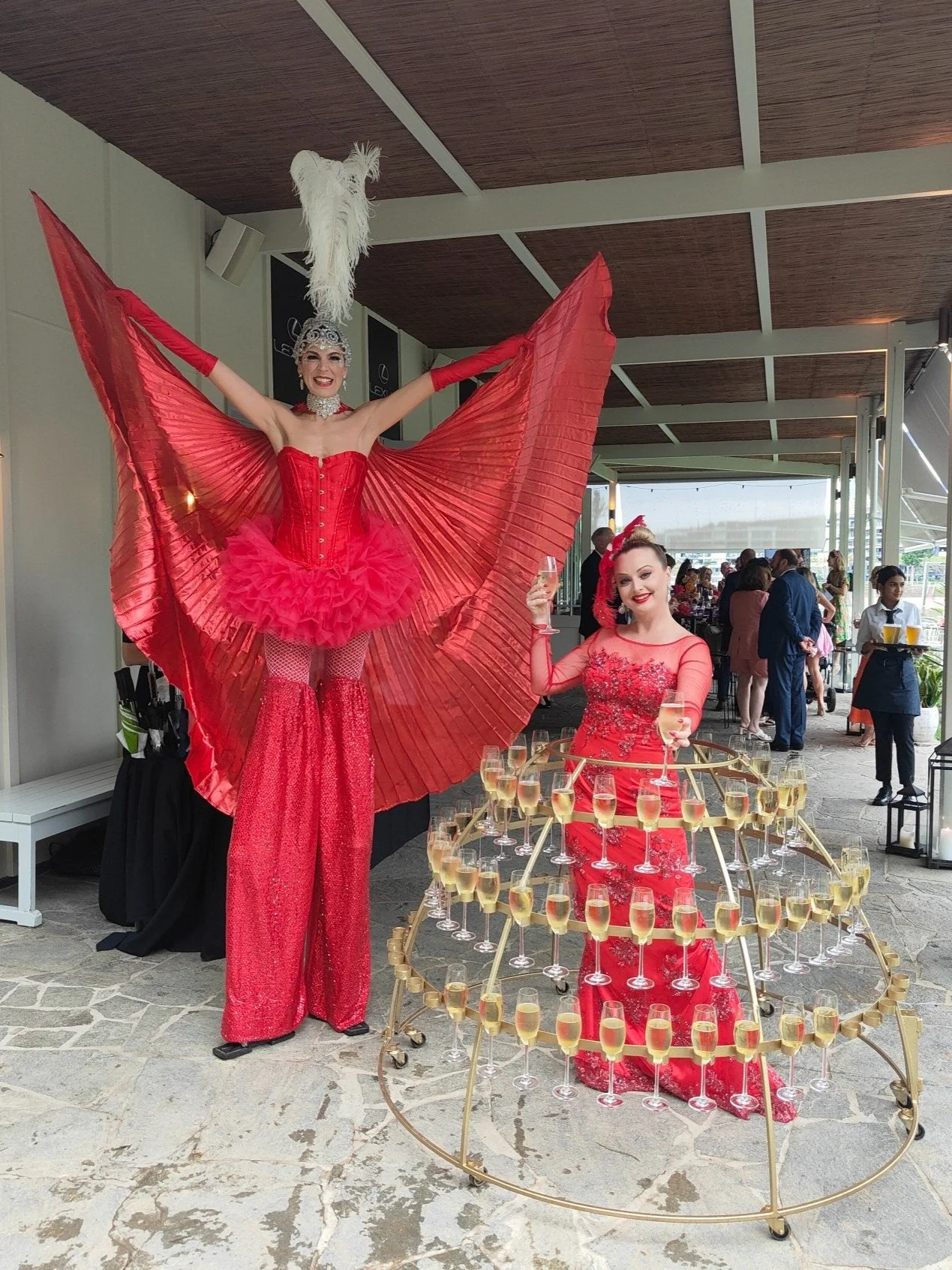 Red showgirl stilts event entertainment Brisbane