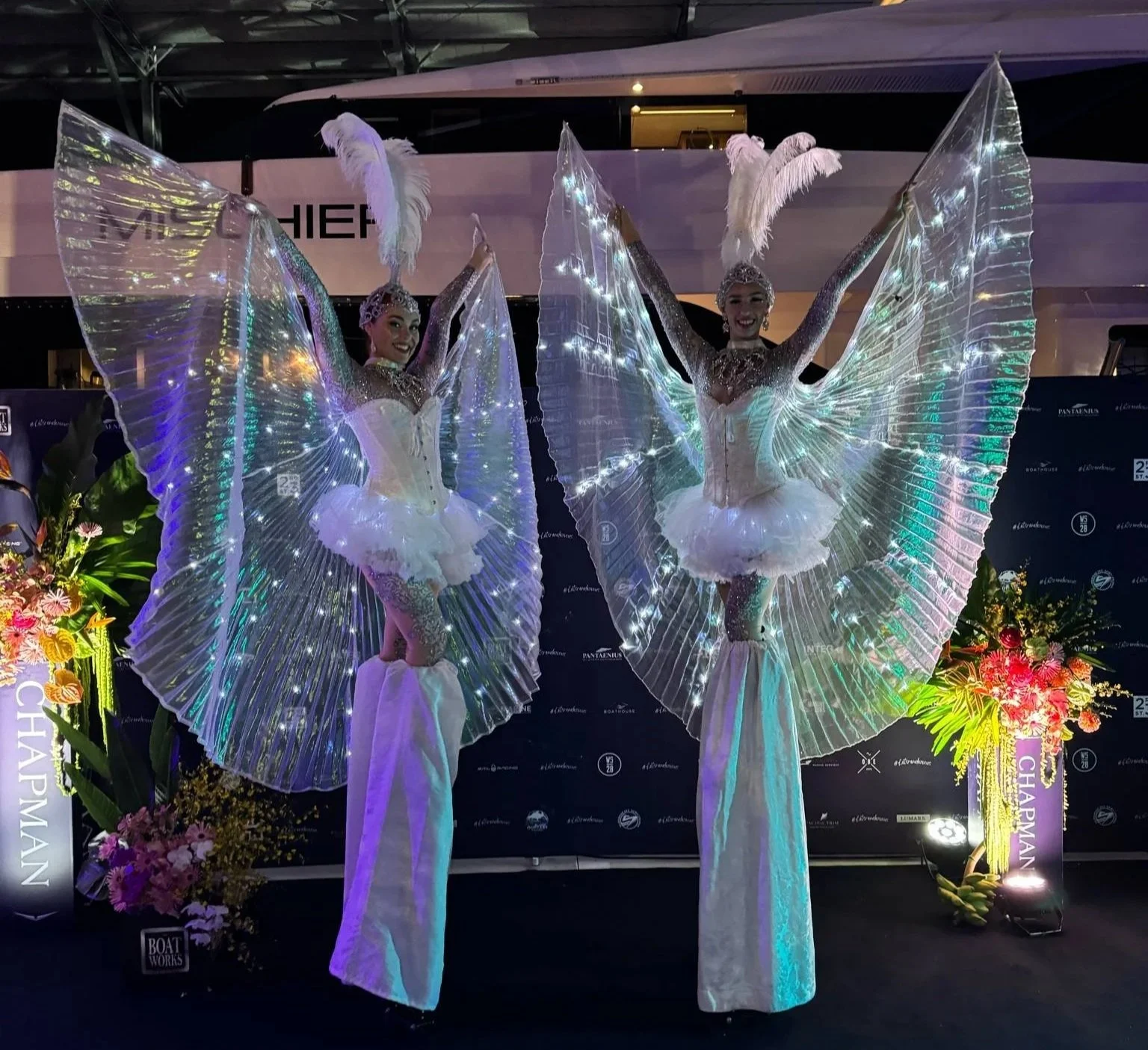 White illuminated roving performer for galas, parties and launches.