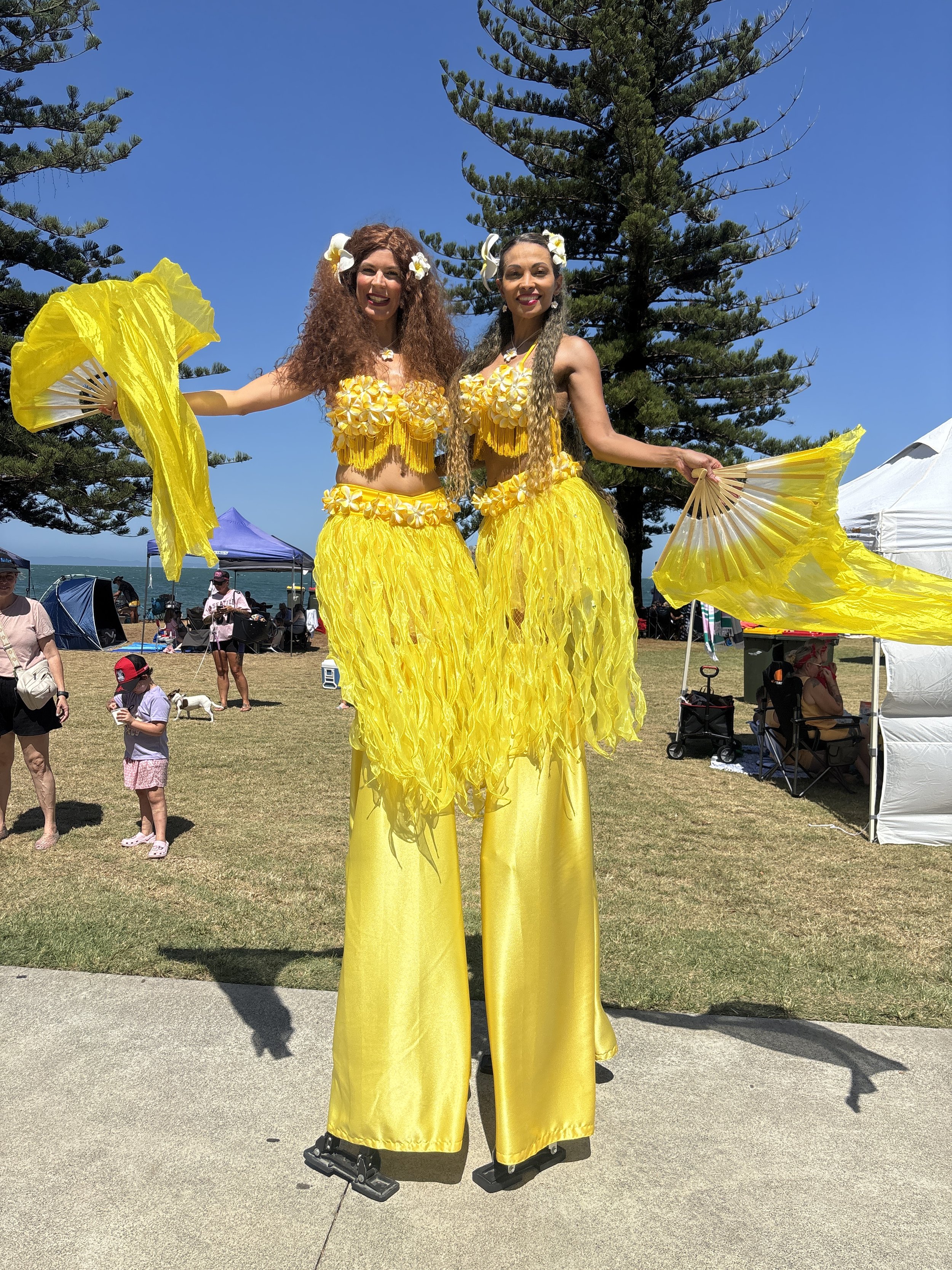 Yellow bright stilts walker polynesian costume