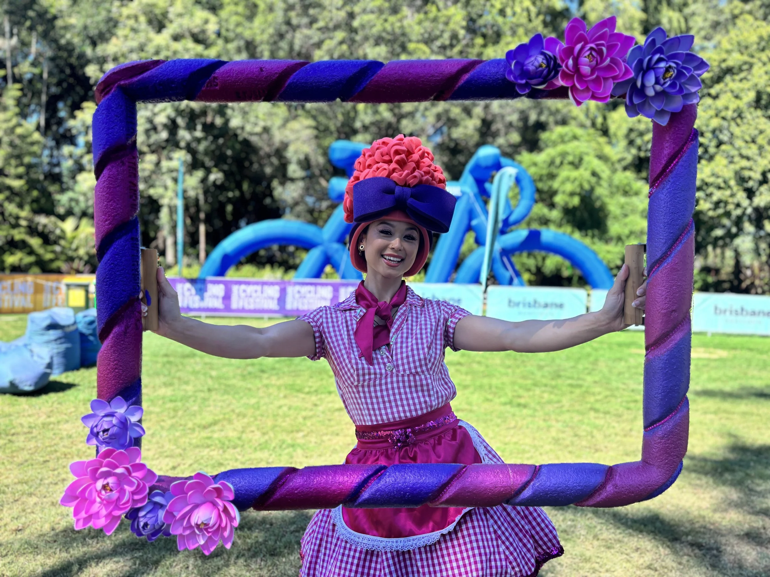 Interactive photo entertainment with themed roaming character and decorative picture frame creating fun guest photo opportunities.