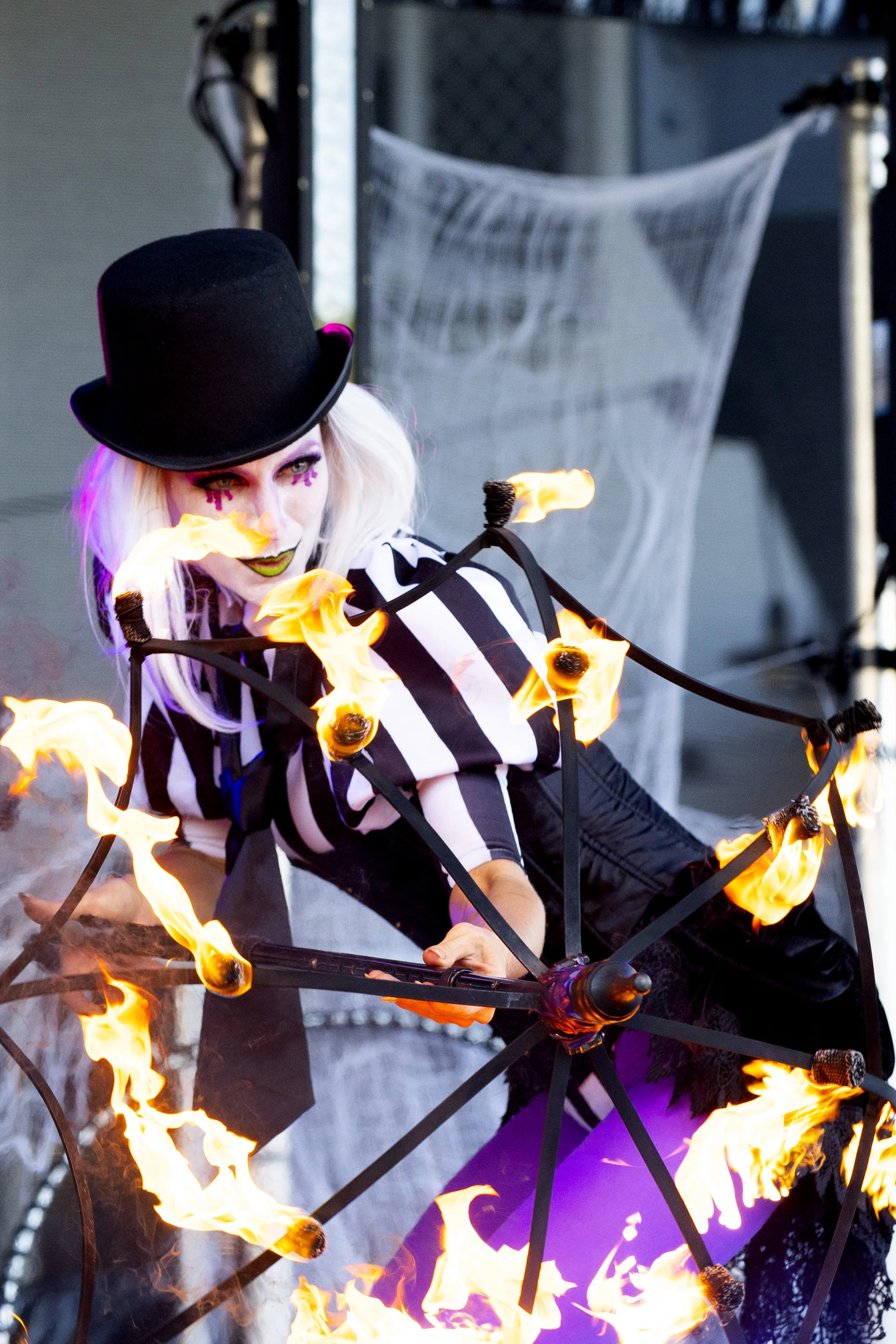 Stage fire show act with costumed entertainer at Brisbane festival