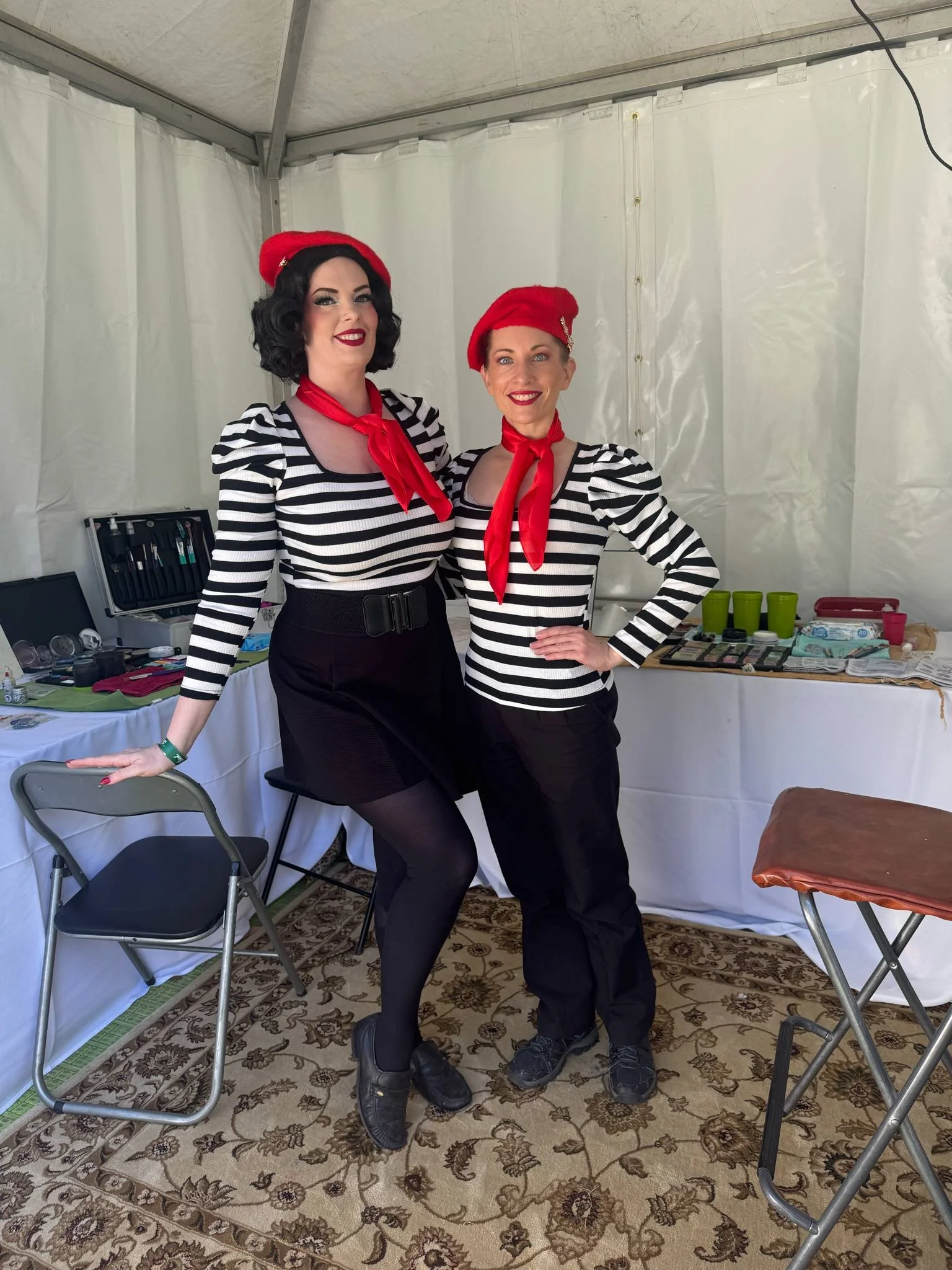 Facepainters dressed in French Festival theme