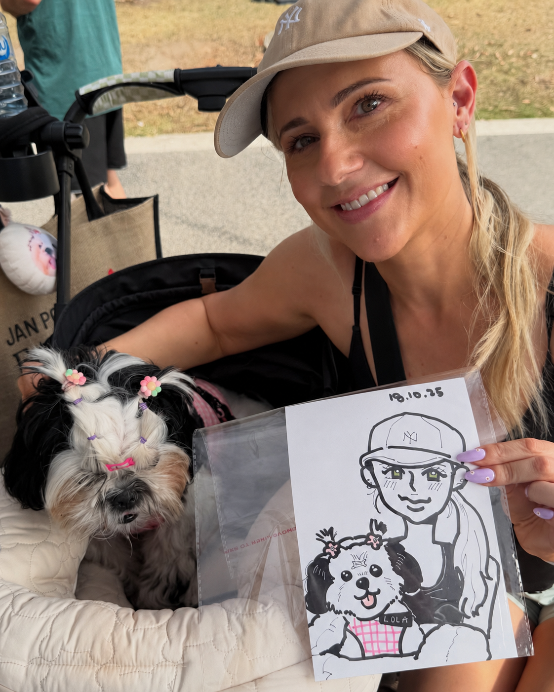 A family holding a fun live caricature portrait created at an indoor community or cultural event.