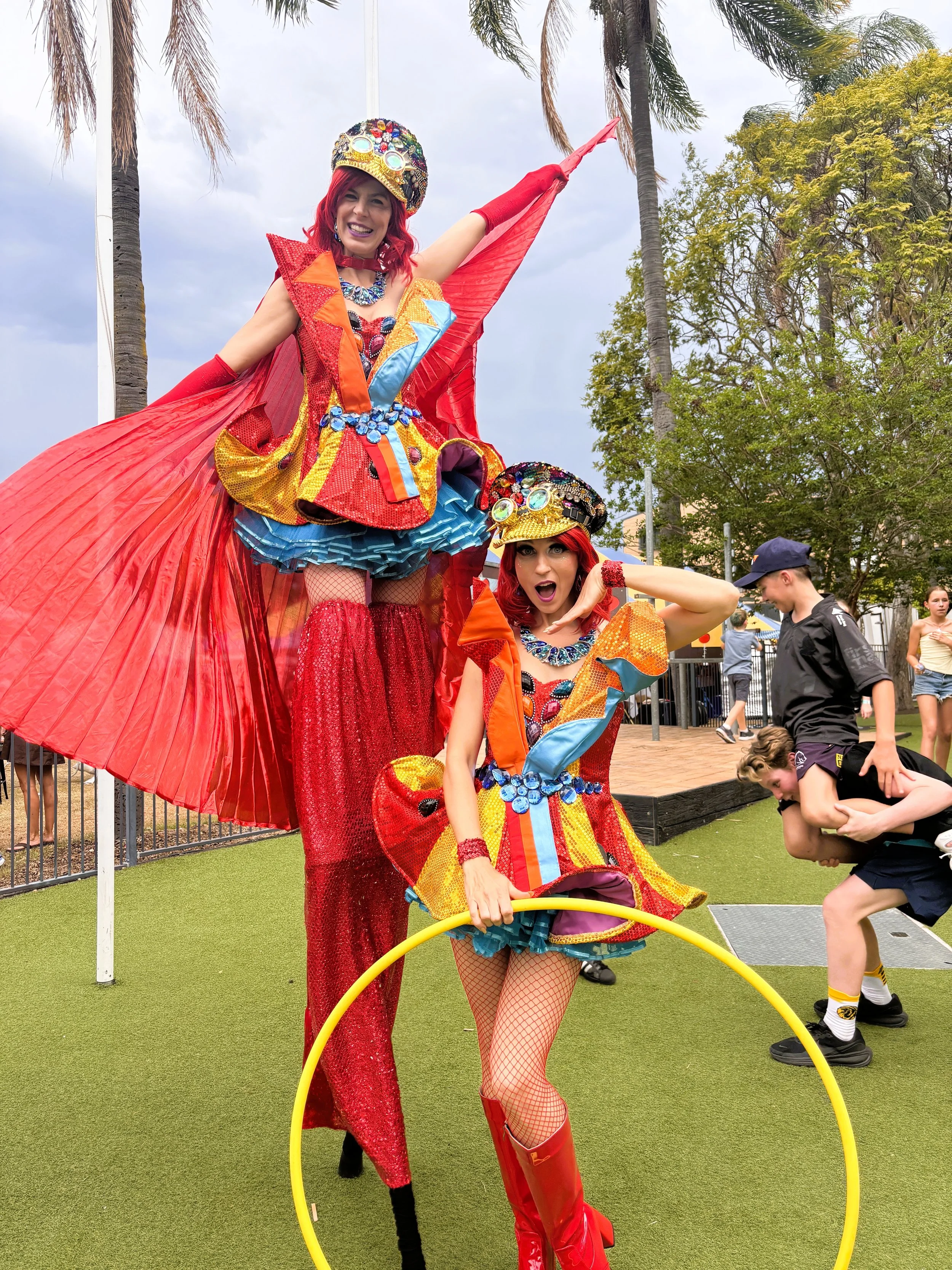 Glamorous costumes stilts and hula hoops