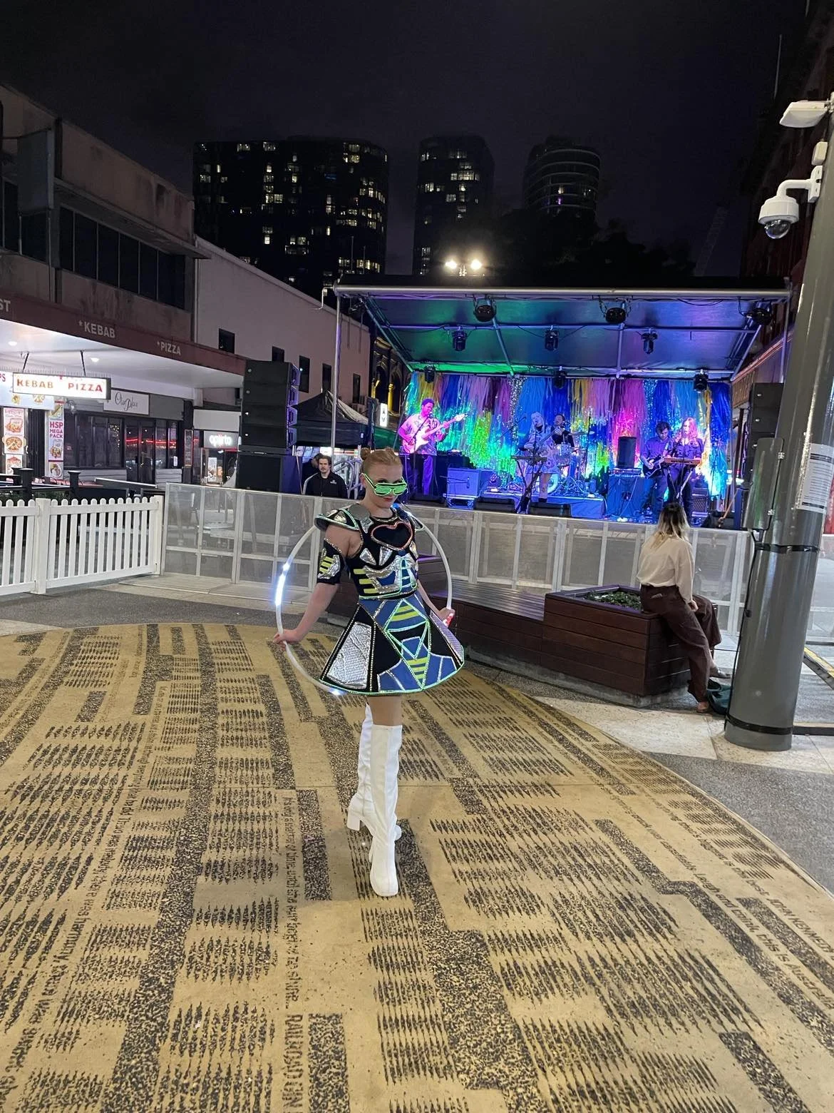 Illuminated LED futuristic, robot, cosmic, galactic, galaxy, space, hula hoop, LED hula hoop roving performer, corporate event, community event, festival, entertainment Brisbane, Gold Coast