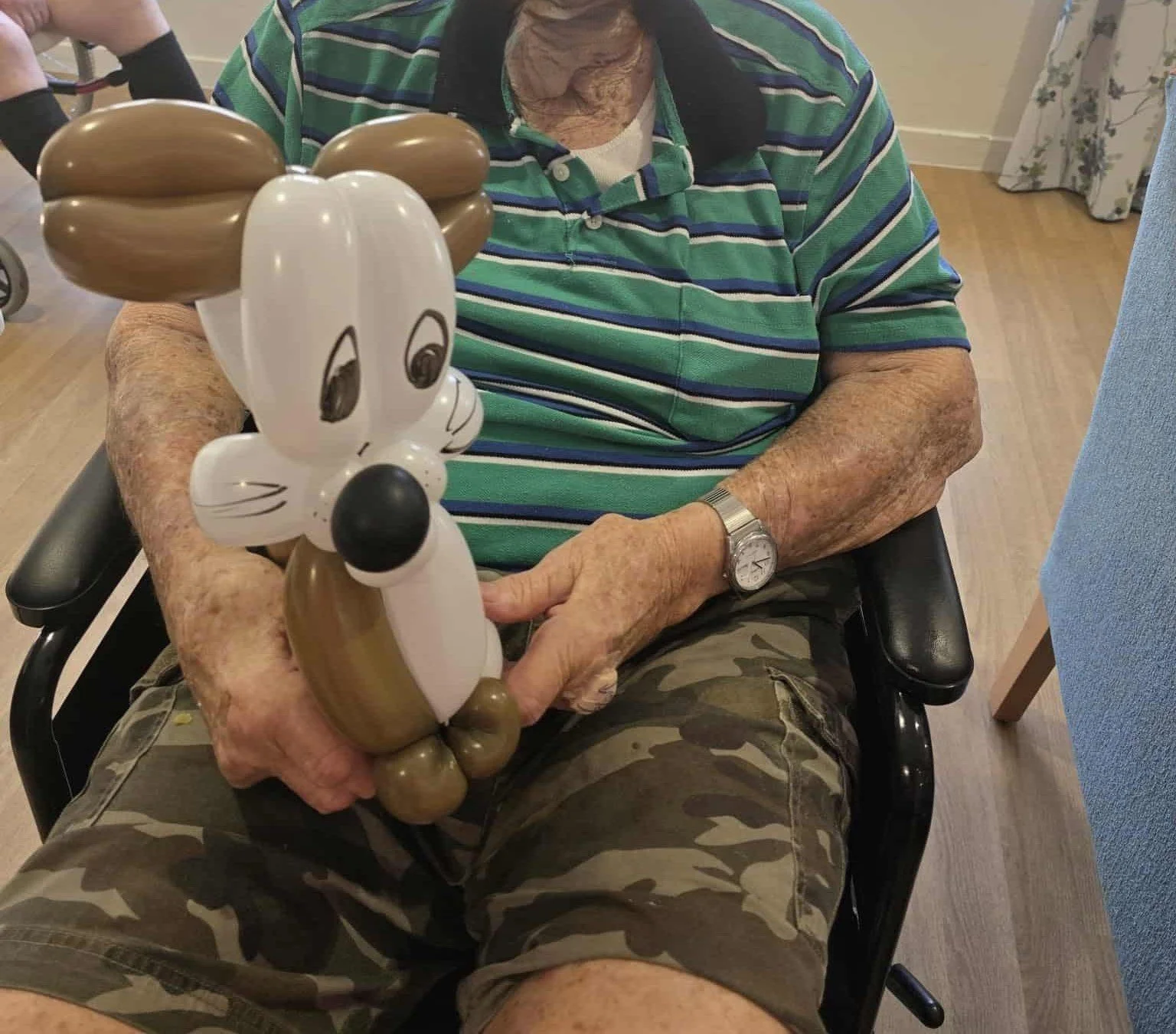 Balloon twisting animals as a fun, hands-on activity for aged care centres on the Gold Coast.