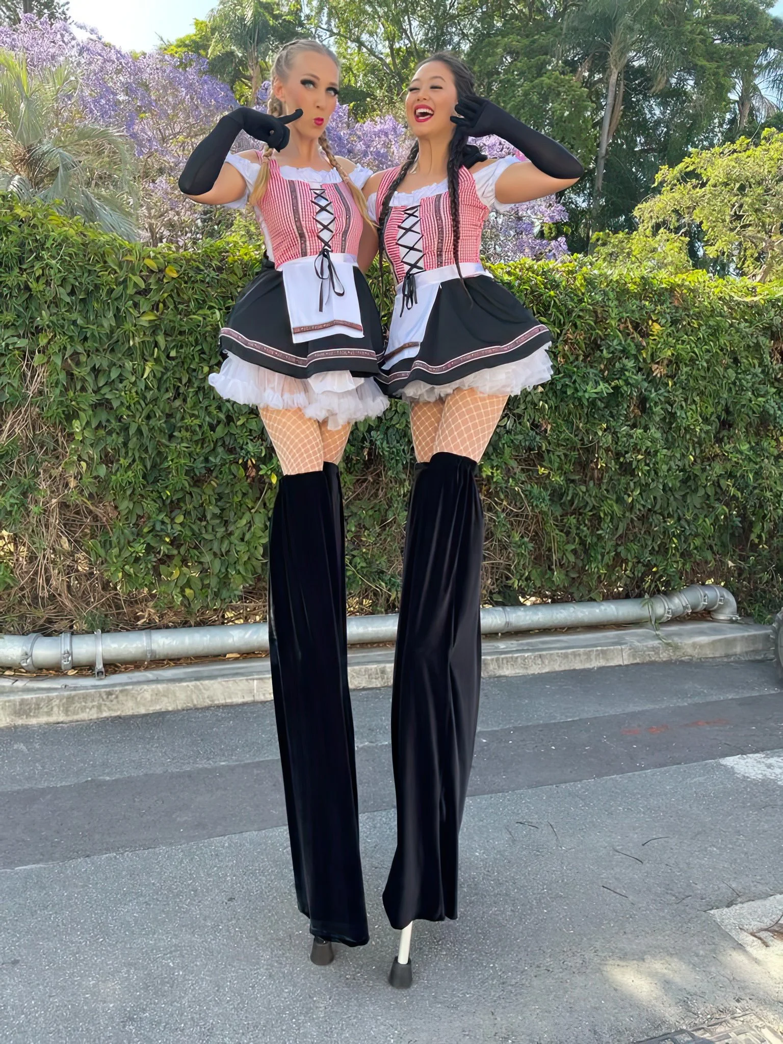 Oktoberfest stilt walkers stilts performers cheeky Bavarian girls roaming performers Gold Coast Oktobefest Festival entertainment