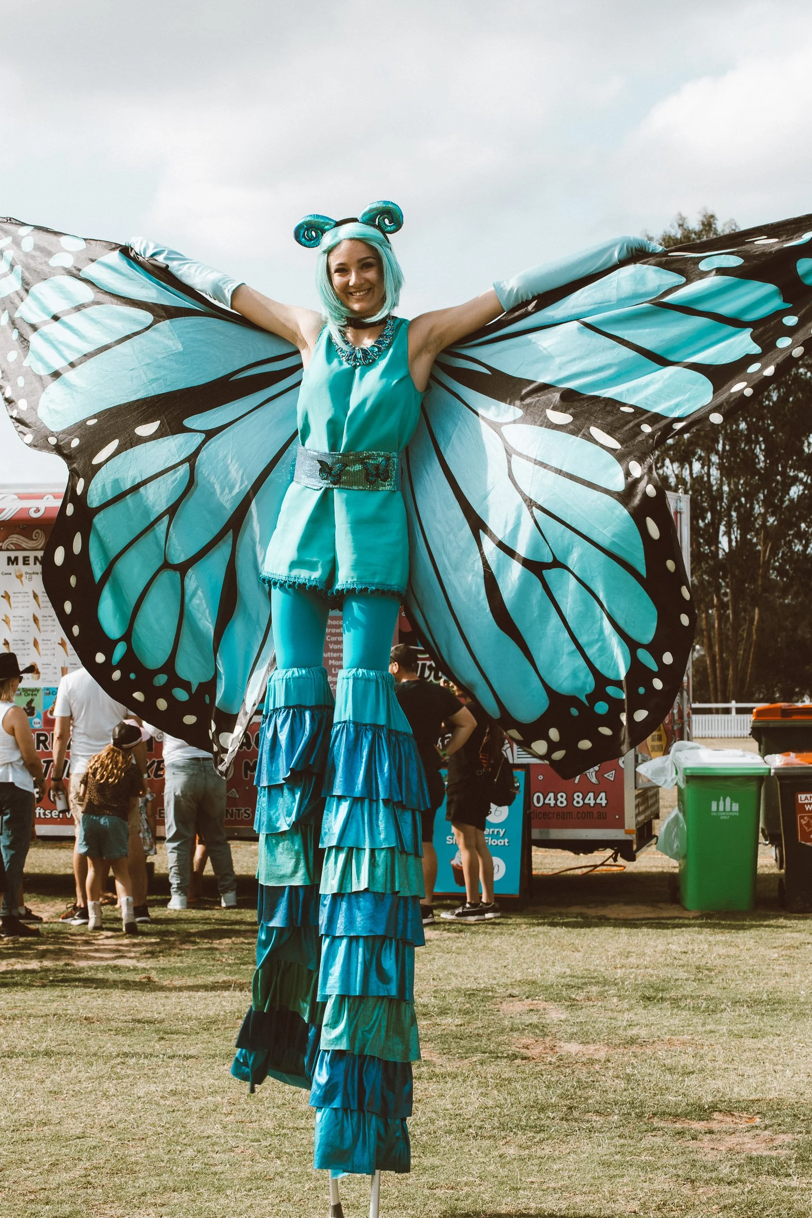 Eyes Up Events, blue butterfly with big wings stilt walker, nature themed event, roving entertainment Brisbane
