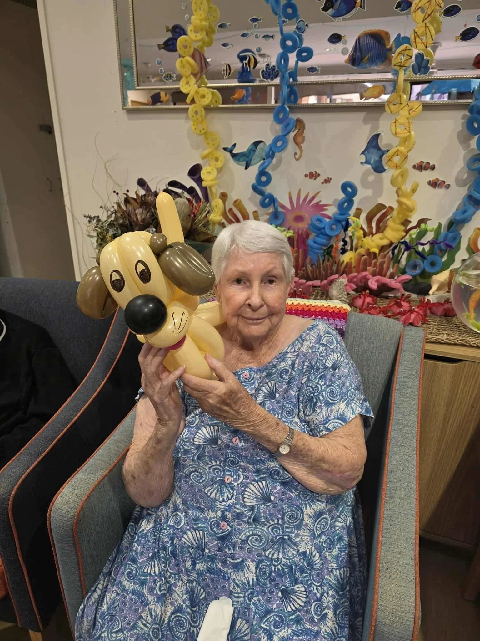 Balloon twisting animal entertainment designed for retirement home activities.