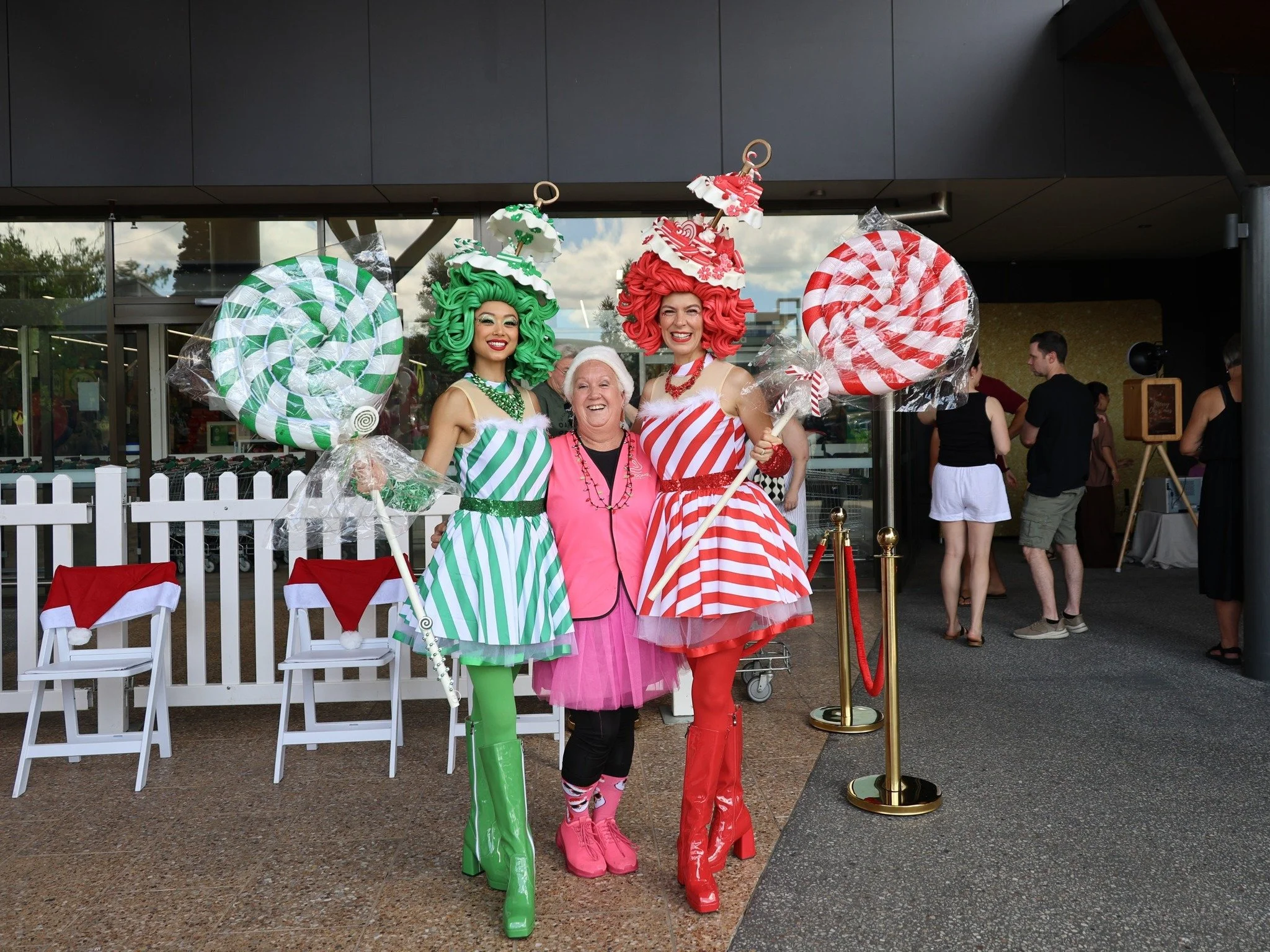 Candy cane roving characters adding colour and fun to Santa photos at Carindale Christmas event.