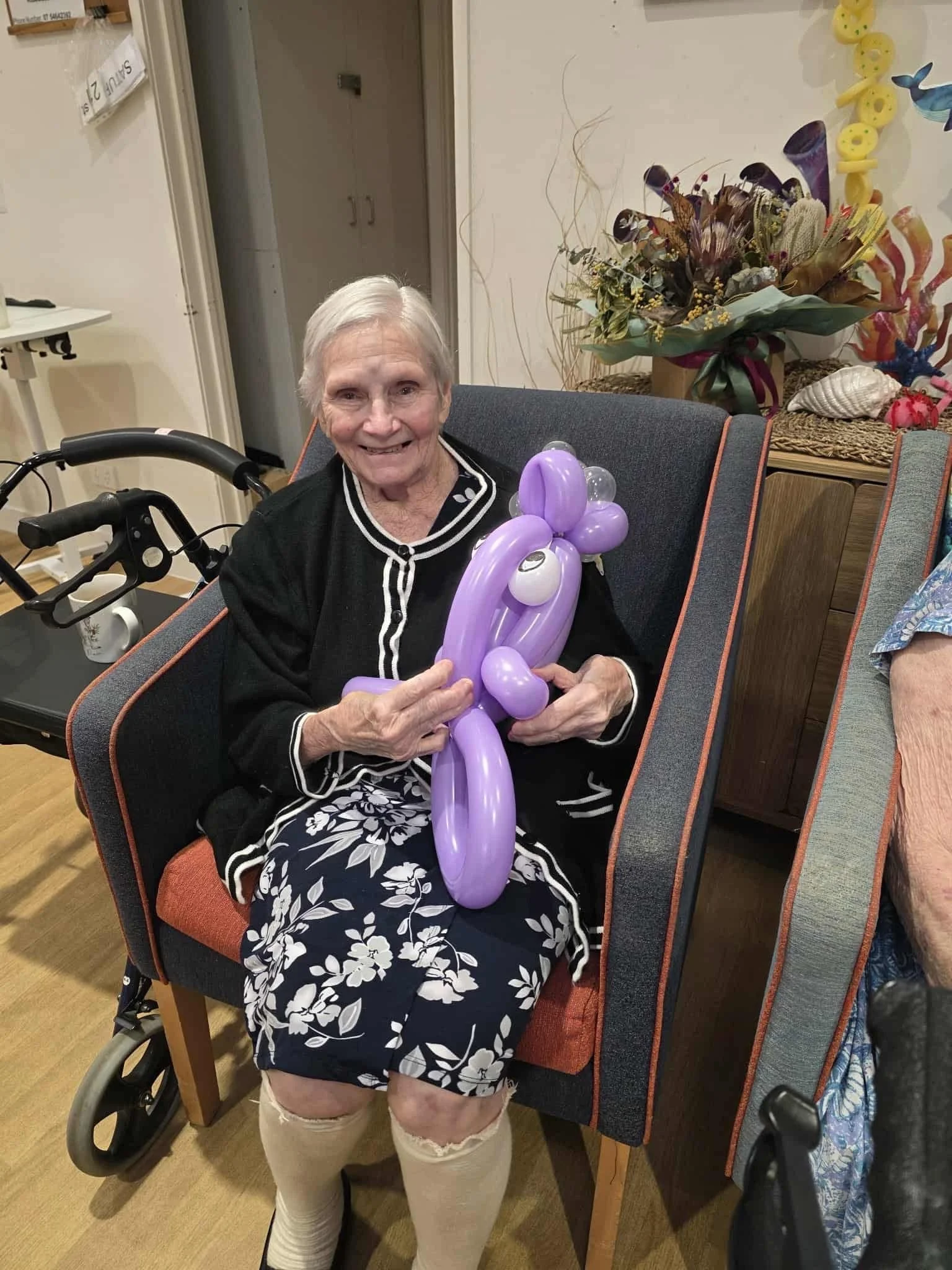 Interactive balloon animal activity for residents in Brisbane retirement villages.