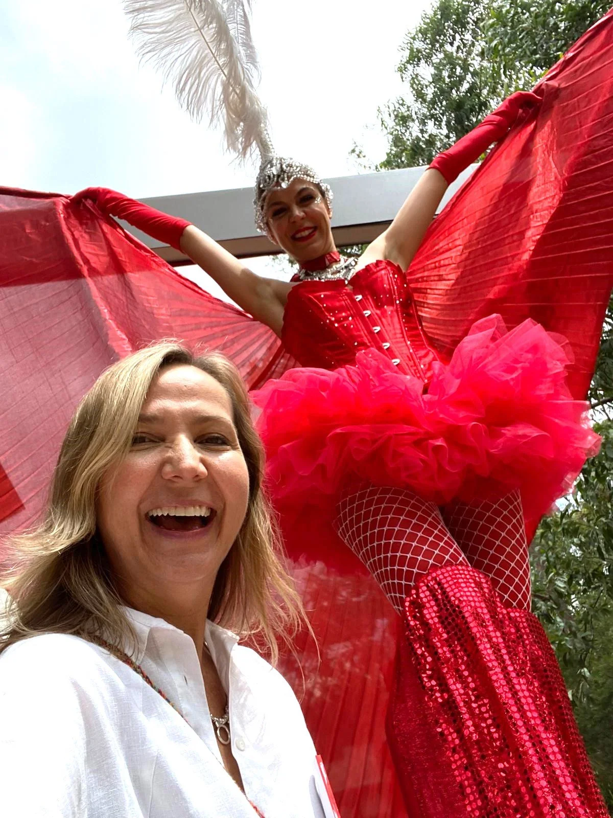 Red showgirl stilts event entertainment Brisbane