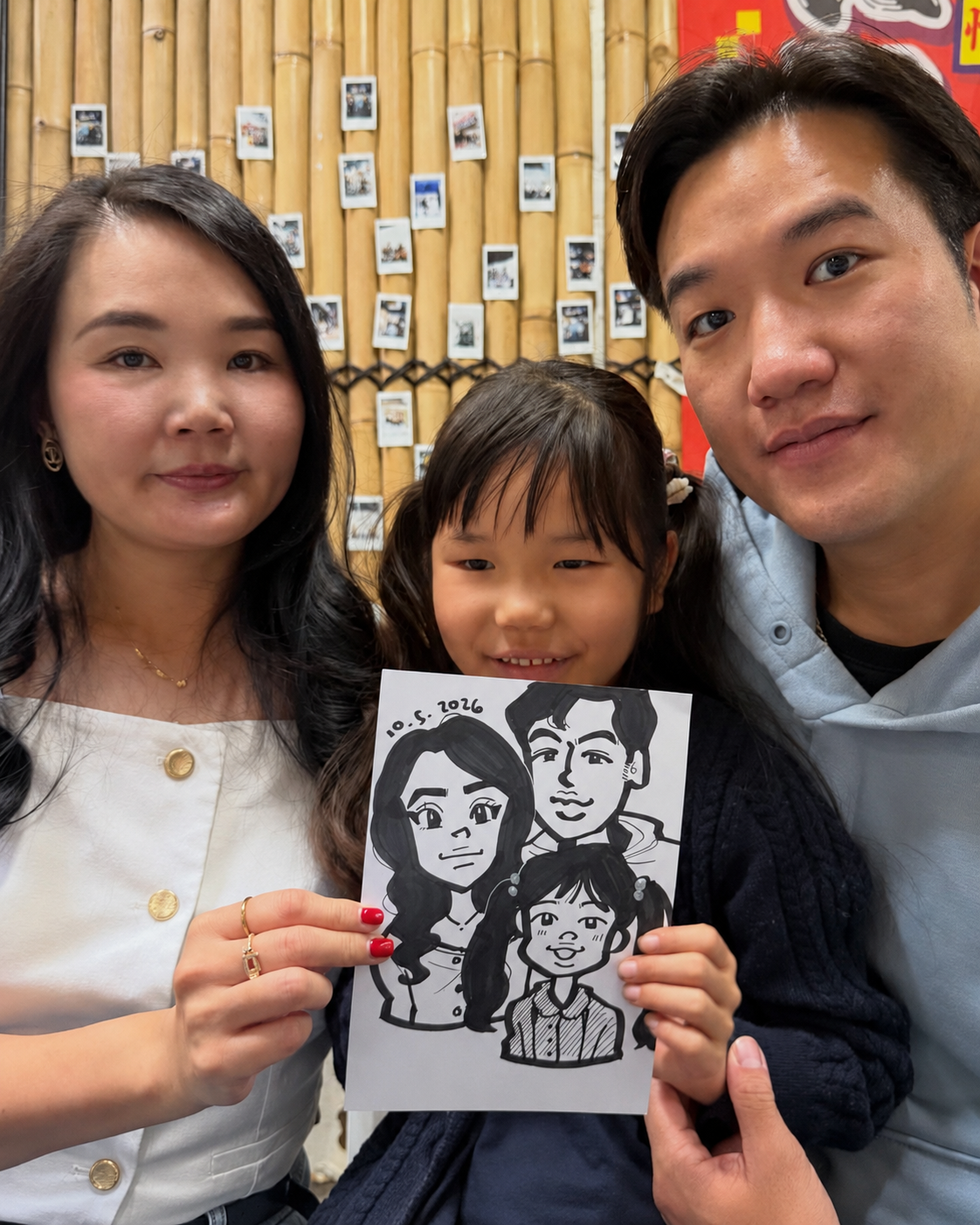 A guest proudly holding a live caricature drawing of herself and her dog at a public event.