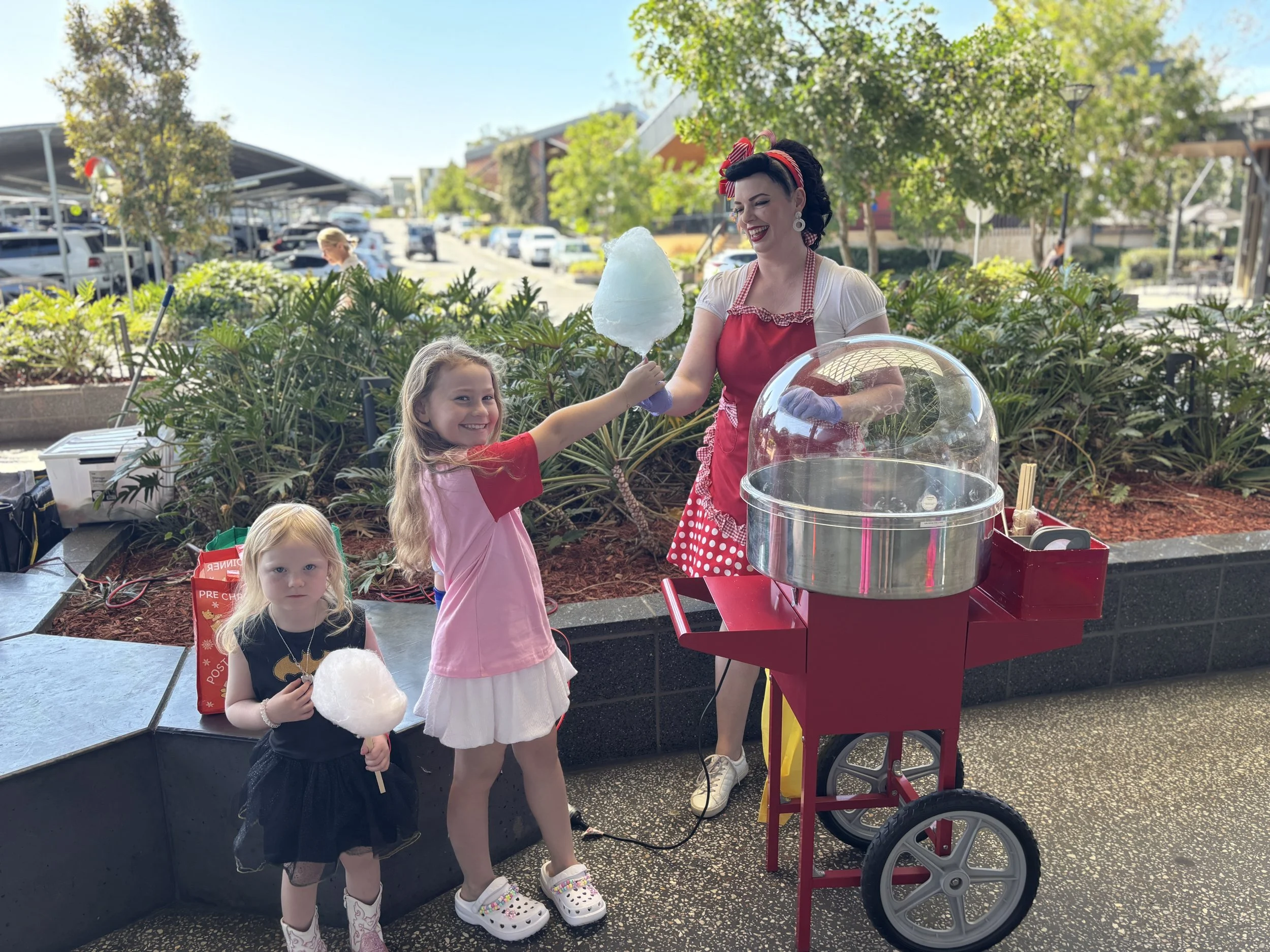 Fairy floss machine and costumed girl
