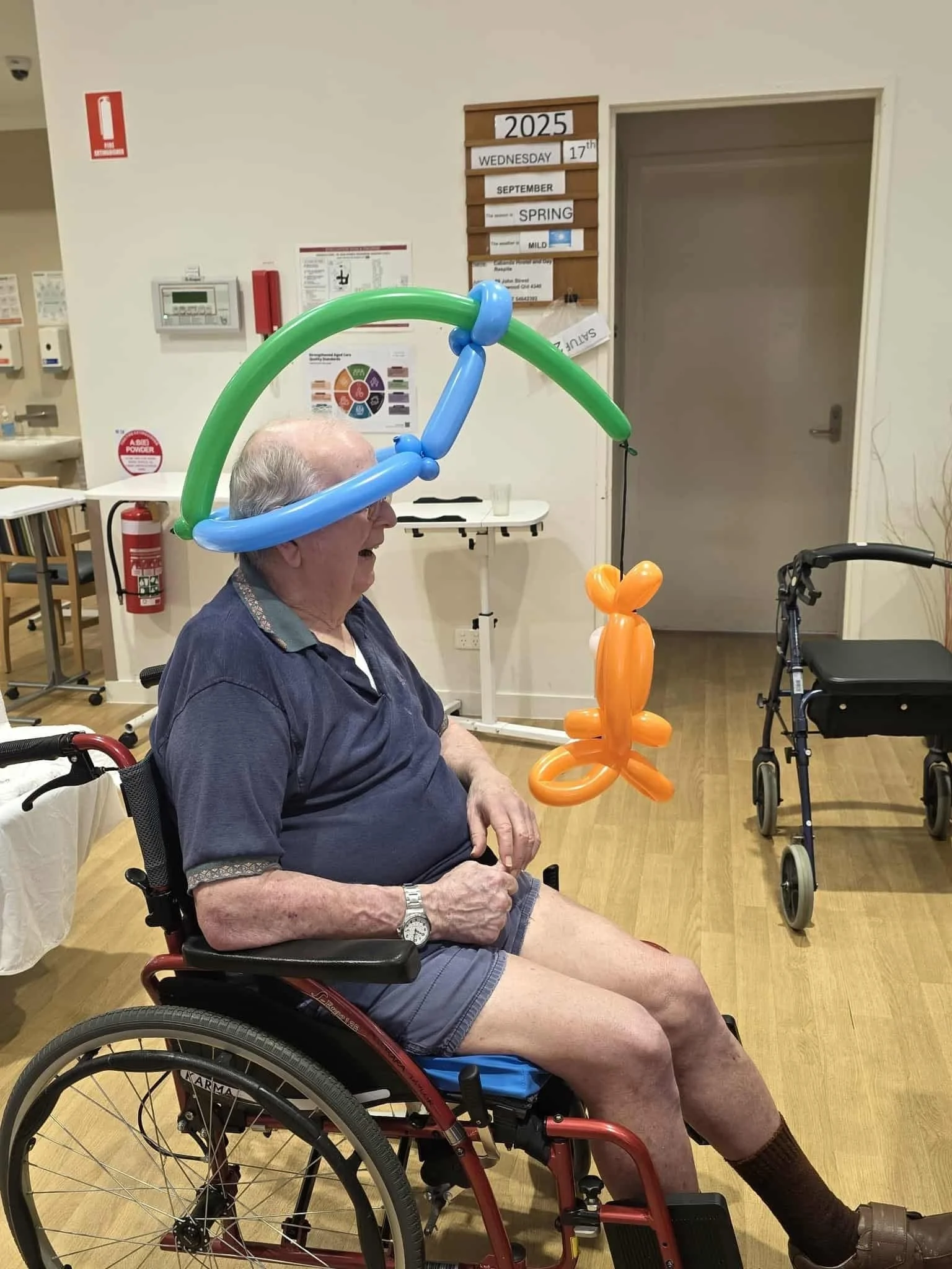 alloon twisting animals used as a gentle, joyful therapy activity in aged care.