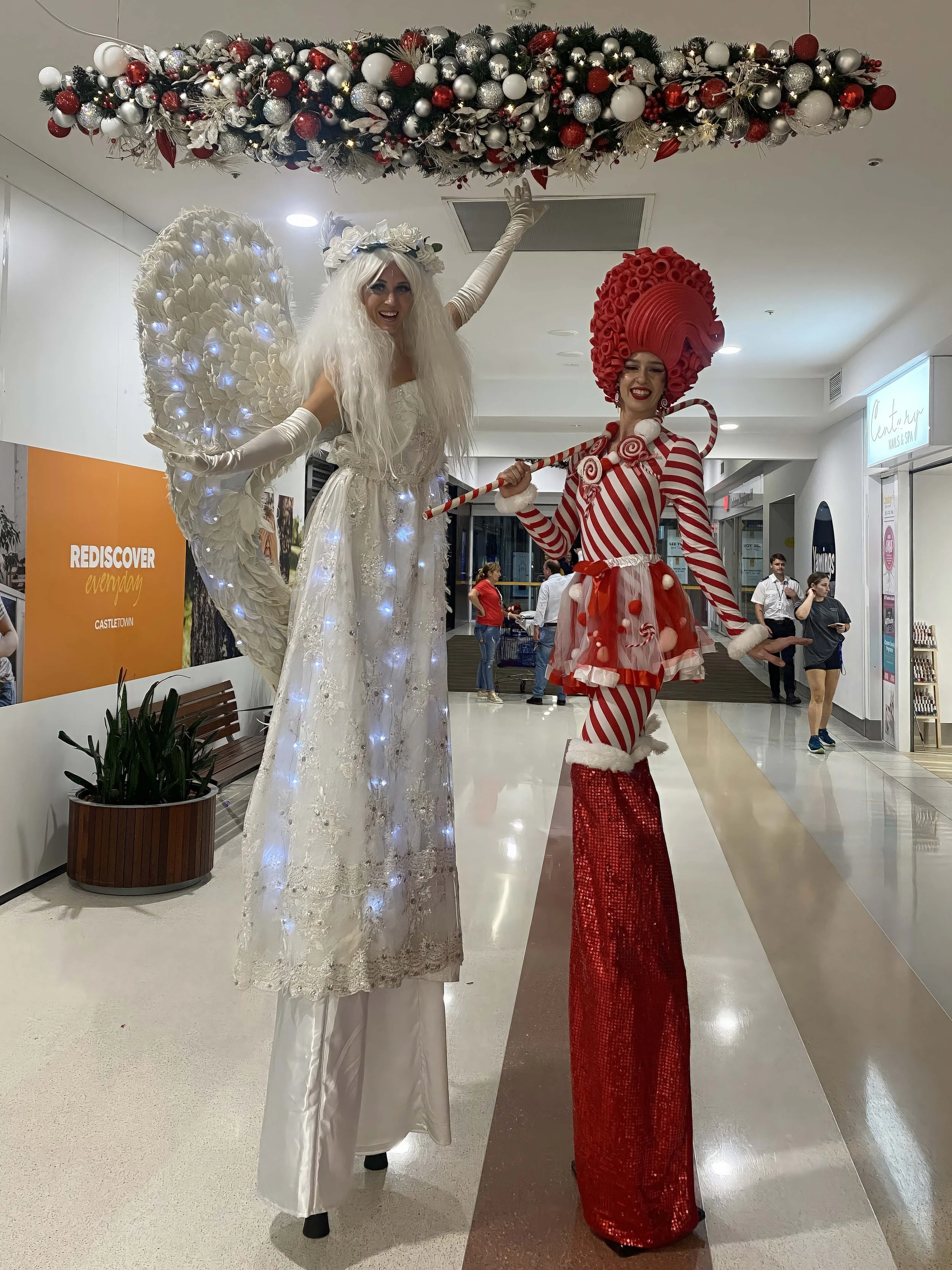 Christmas candy cane stilts walking event entertainment, roaming performer, Brisbane