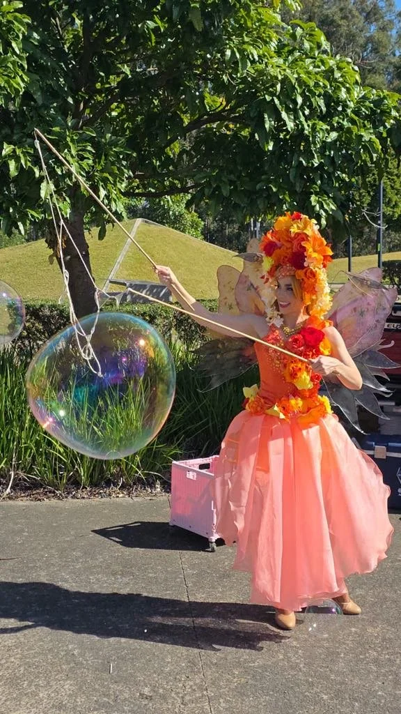 Orange fairy bubble performer