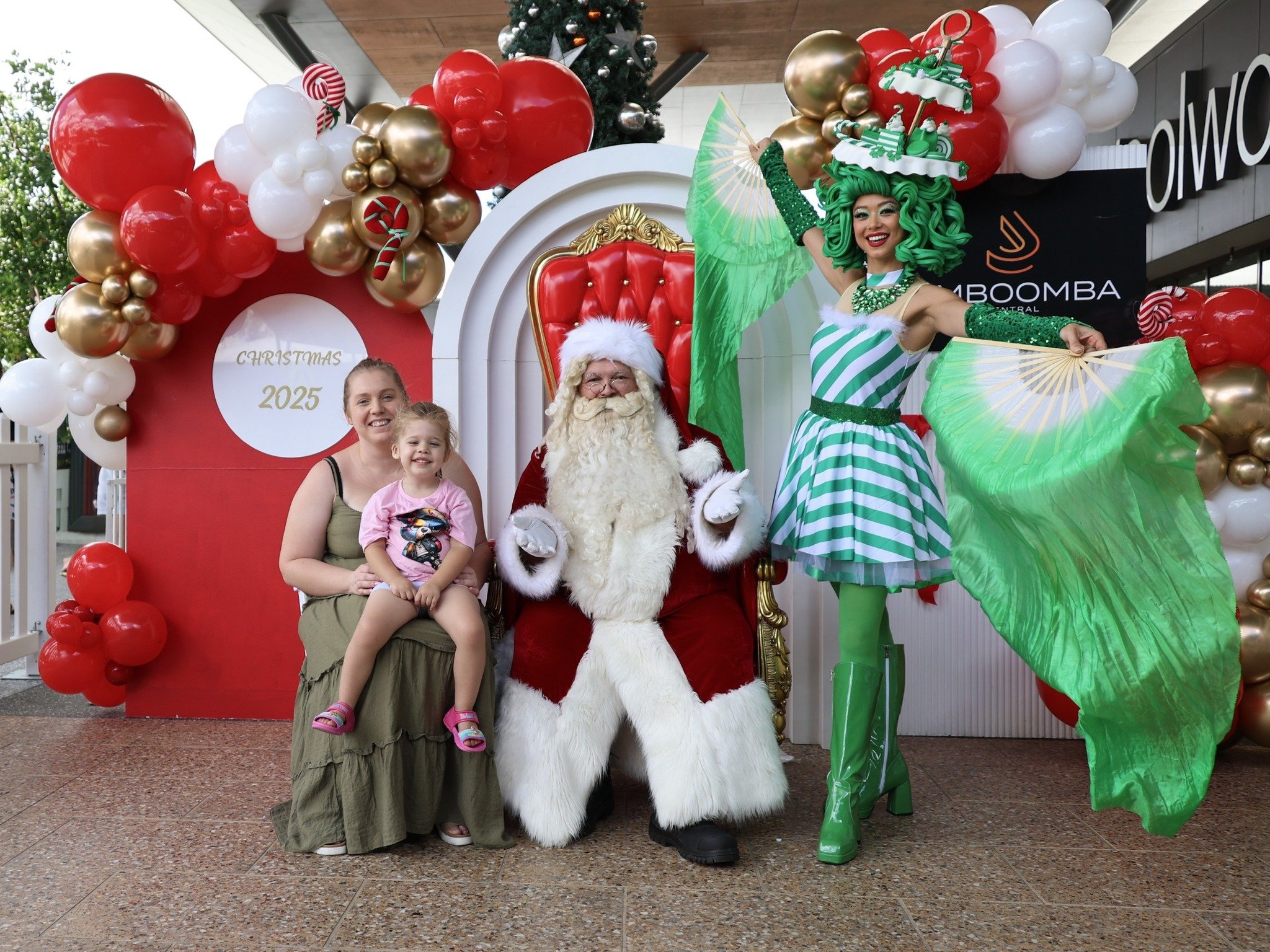 Santa photos enhanced by bright candy performers at Westfield North Lakes Christmas activation.