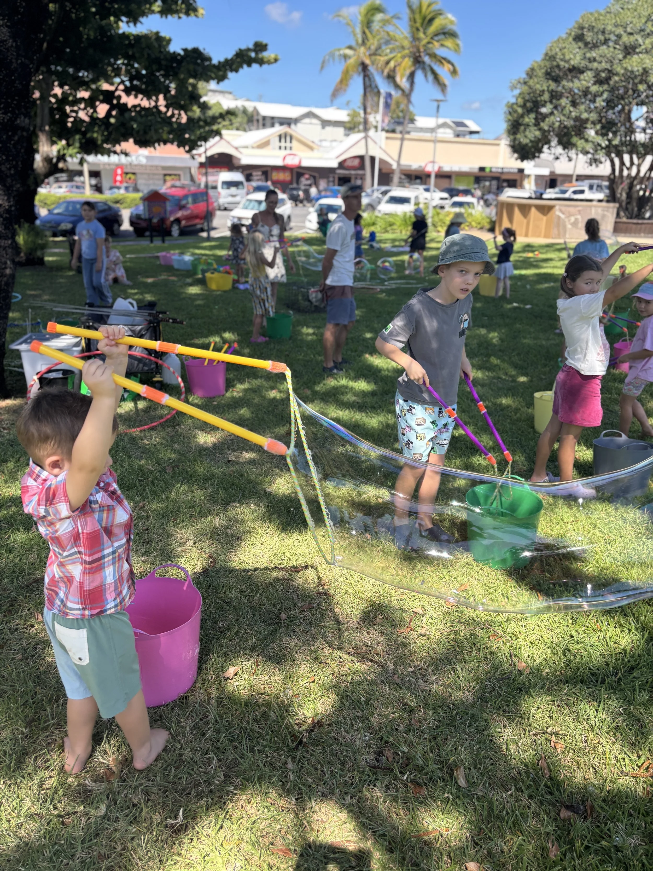 Family-friendly bubble entertainment with colourful buckets and giant bubbles