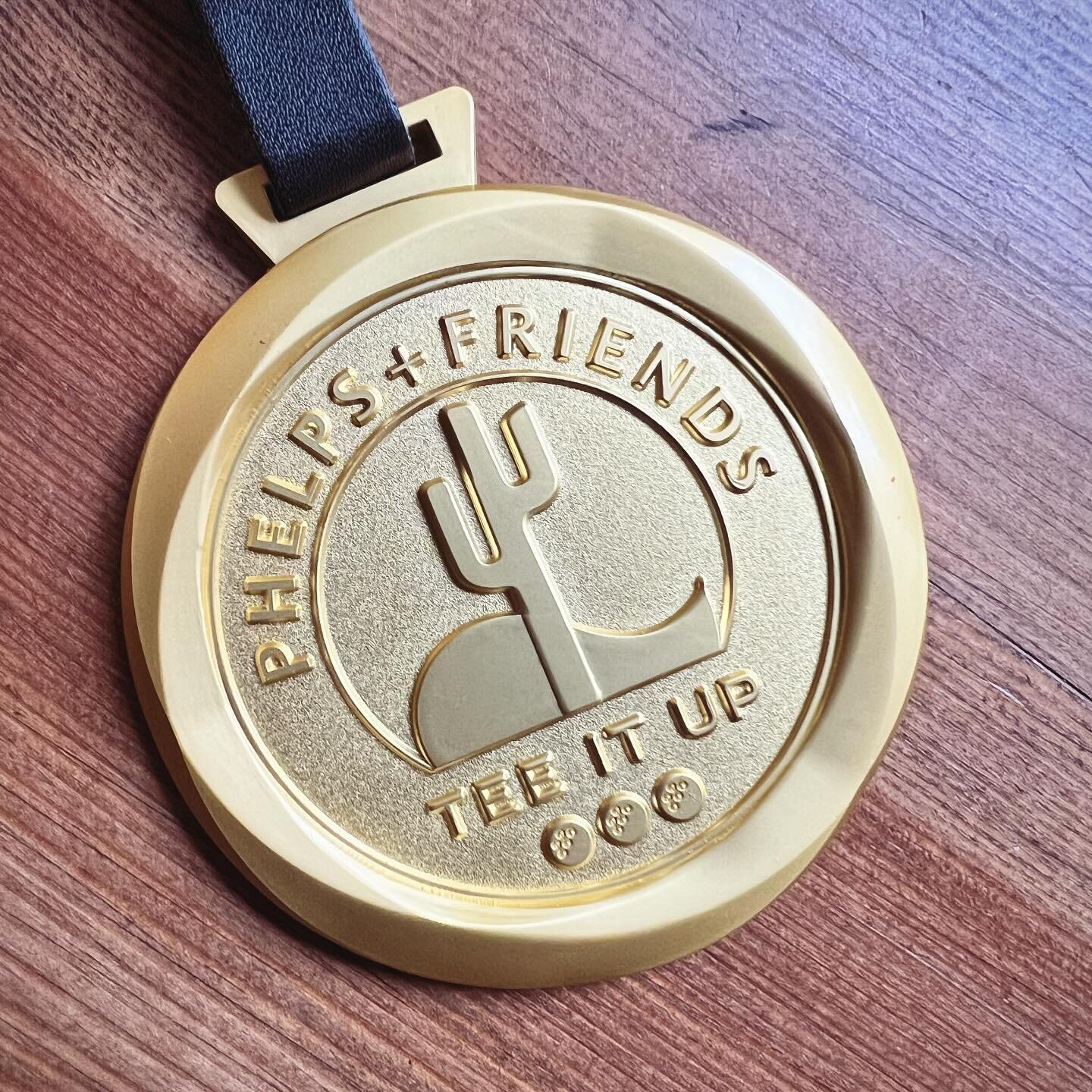 How flippin&rsquo; cute is this medal @mpfoundation just dropped off which they had made with the fundraiser event logo I designed? 🏅🌵⛳️ 🏊&zwj;♂️ 

#logodesigner #eventbranding #nonprofitbranding #logo #michaelphelps #golffundraiser #merch